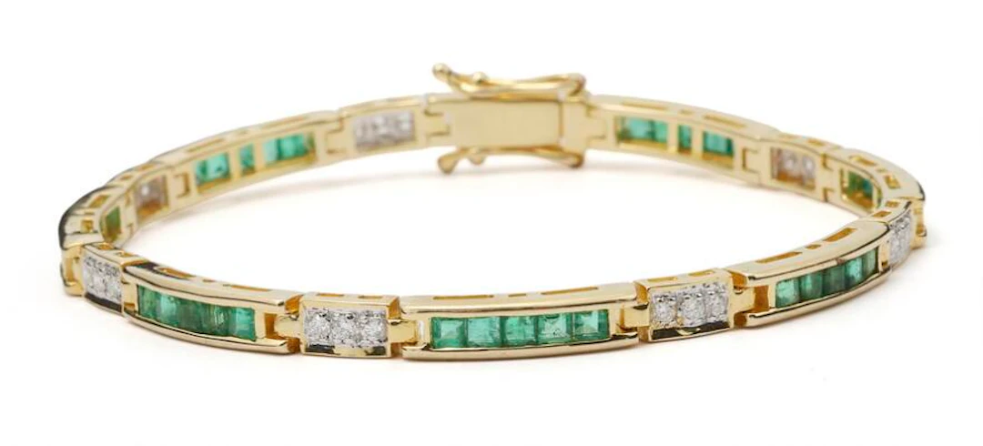 An emerald and diamond bracelet set with emeralds and diamonds, mounted
