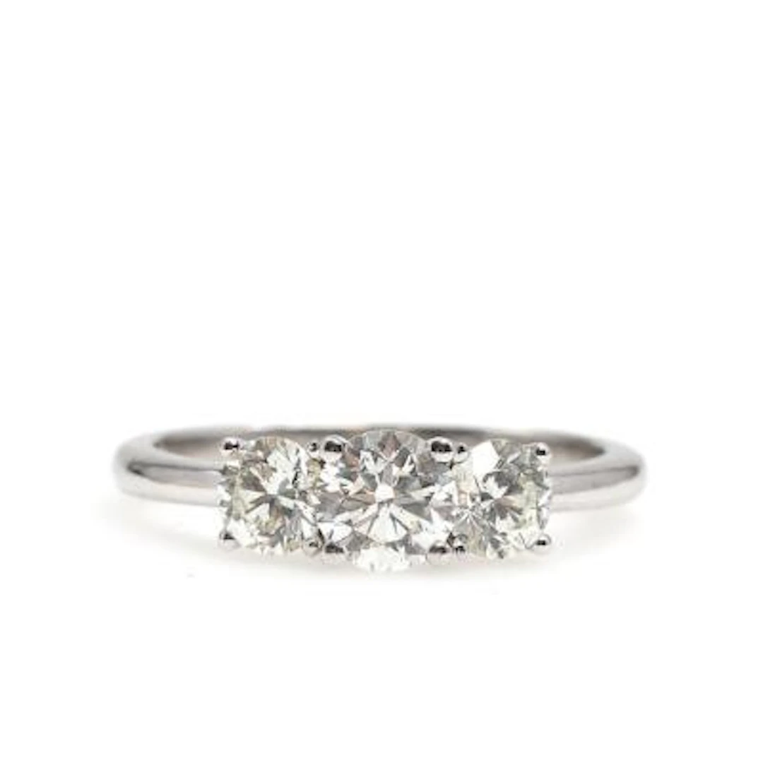 A diamond ring set with three brilliant-cut diamonds weighing a total