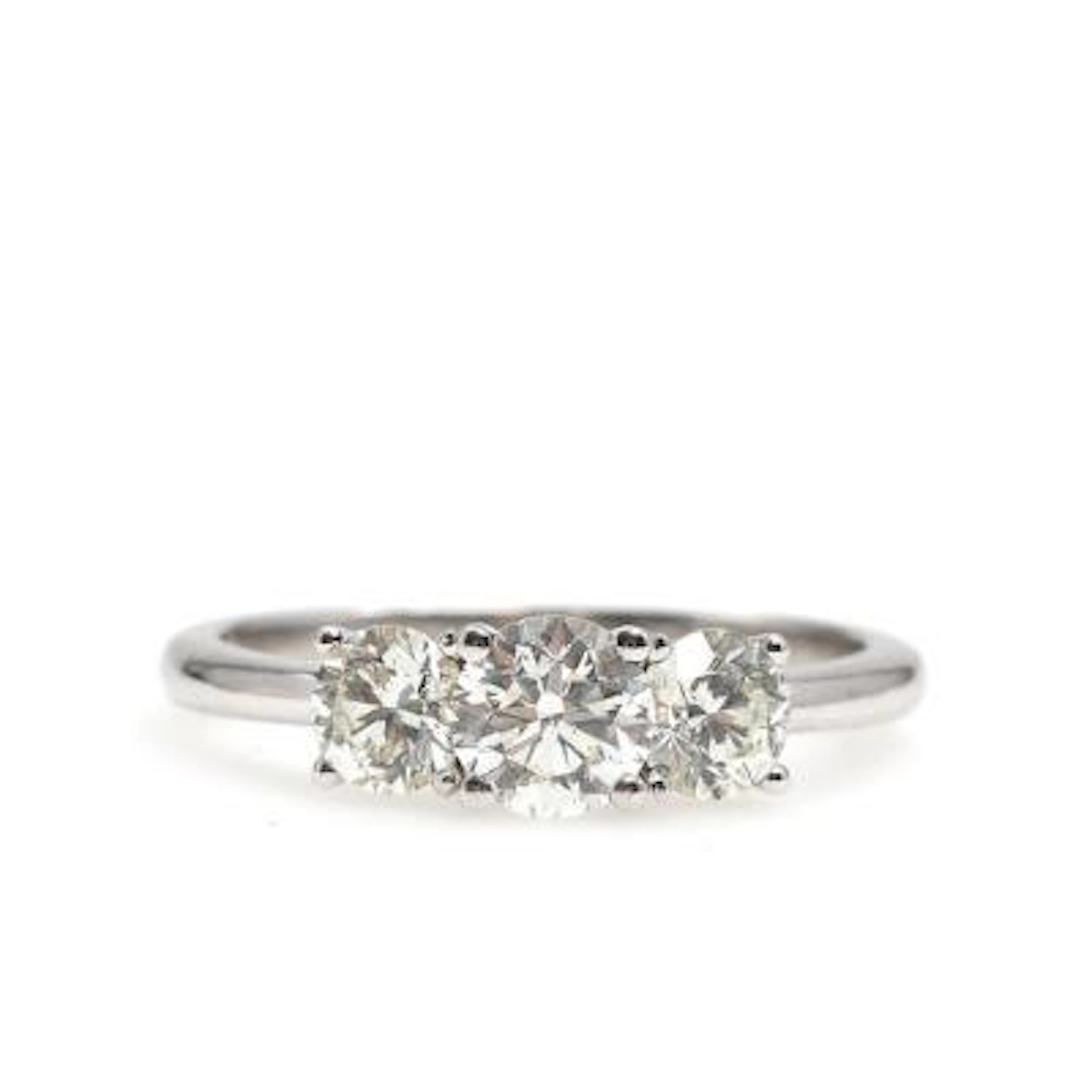 A diamond ring set with three brilliant-cut diamonds weighing a total
