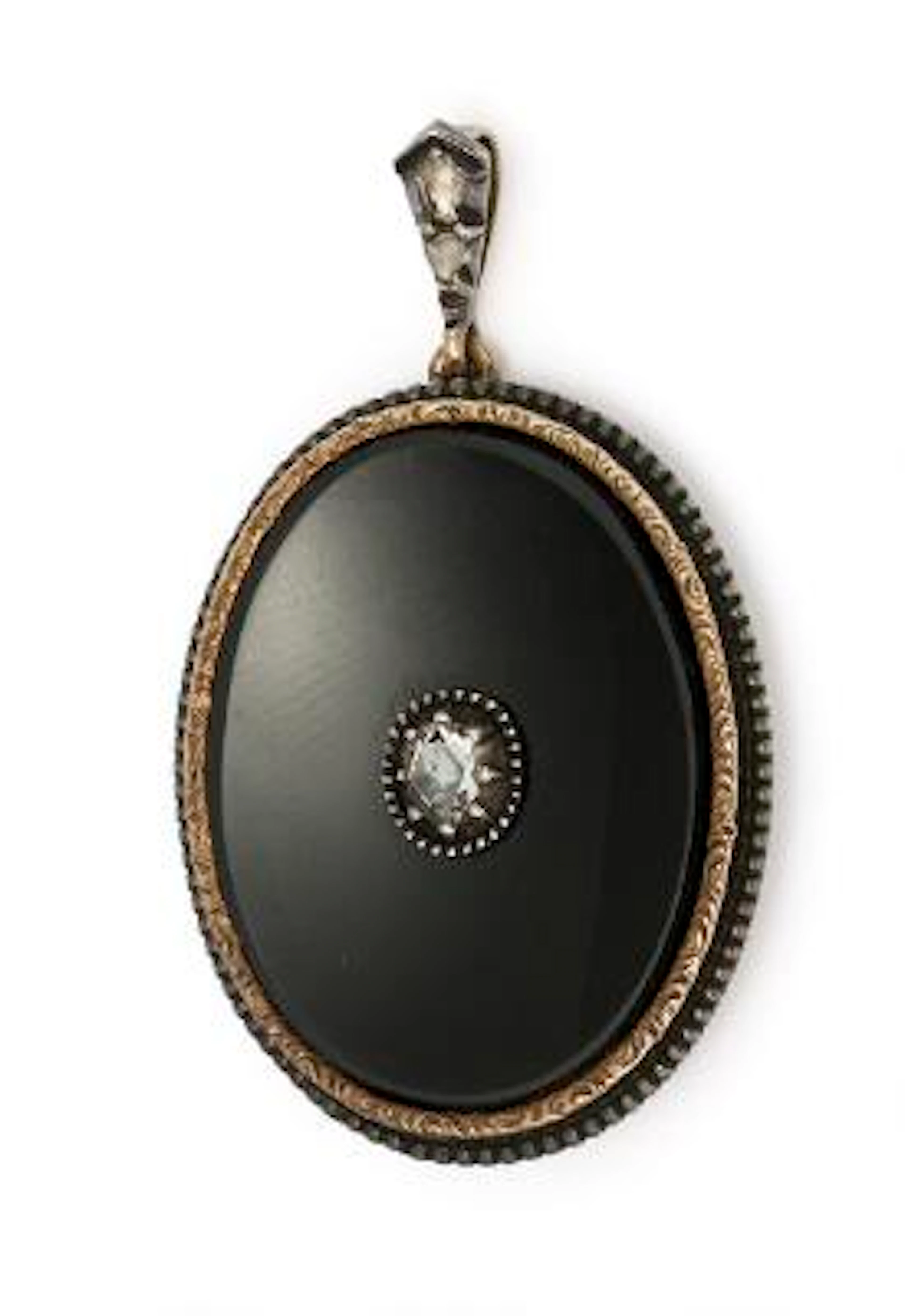 A pendant set with black onyx and three rose-cut diamonds, mounted