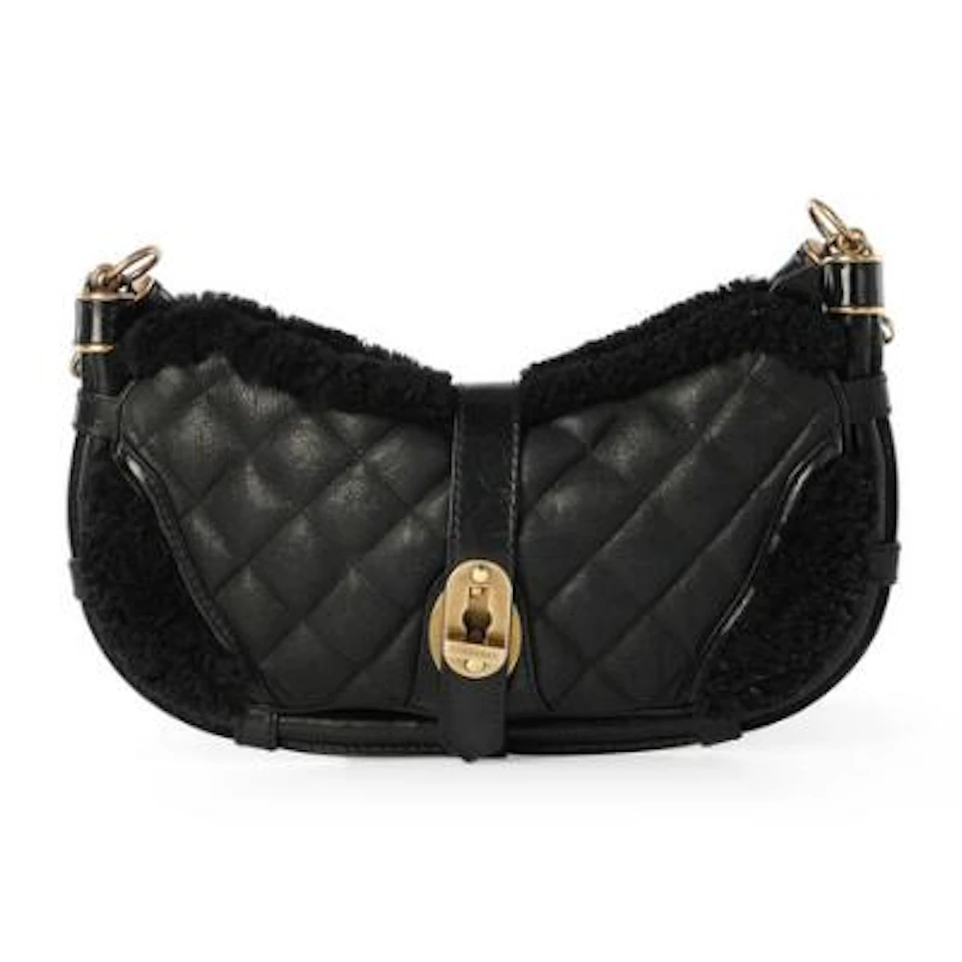 Burberry: A "Prorsum Shearling Bag" of black quilted lamb skin and