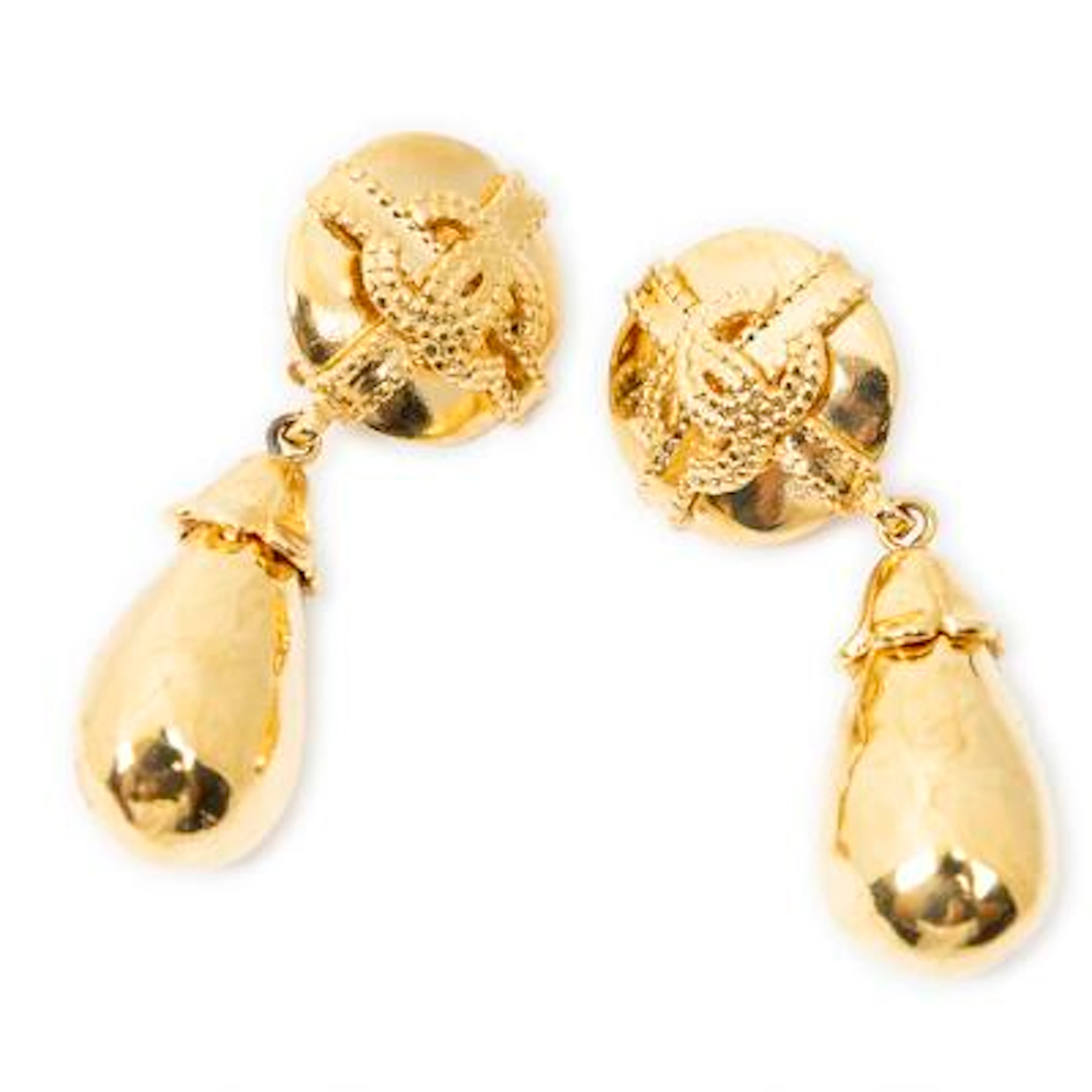Chanel: A pair of ear clips of gold-tone metal each set with CC logo
