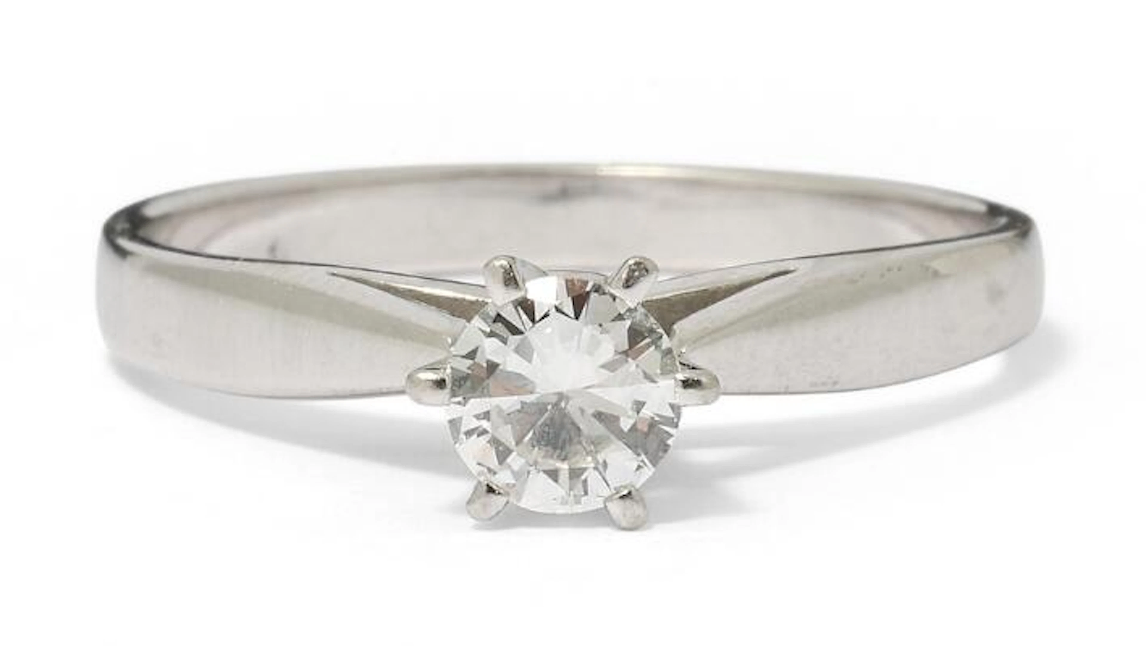 A solitaire diamond ring set with a brilliant-cut diamond, mounted