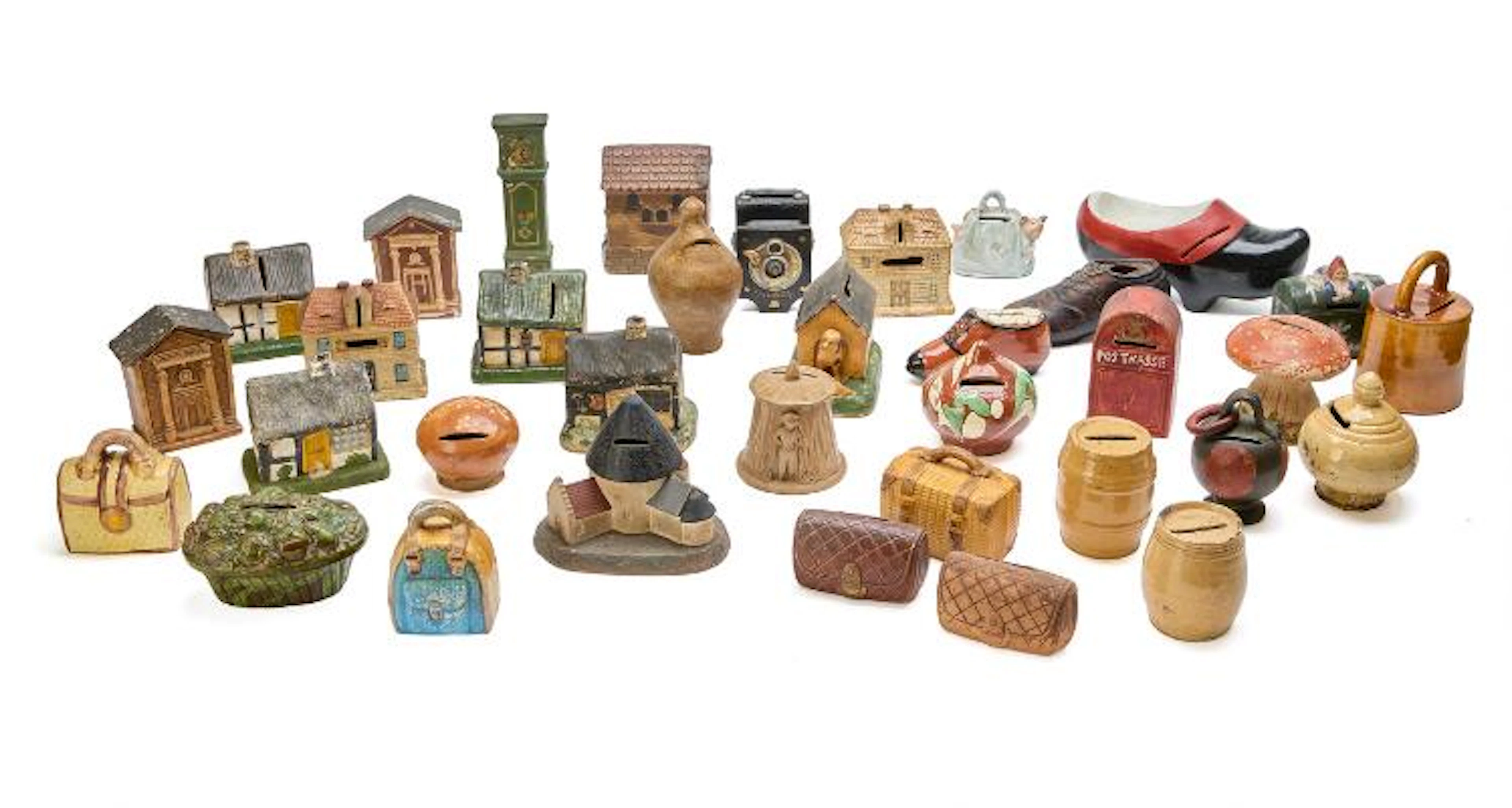 Collection of money boxes in the form of houses, bags, shoes etc.