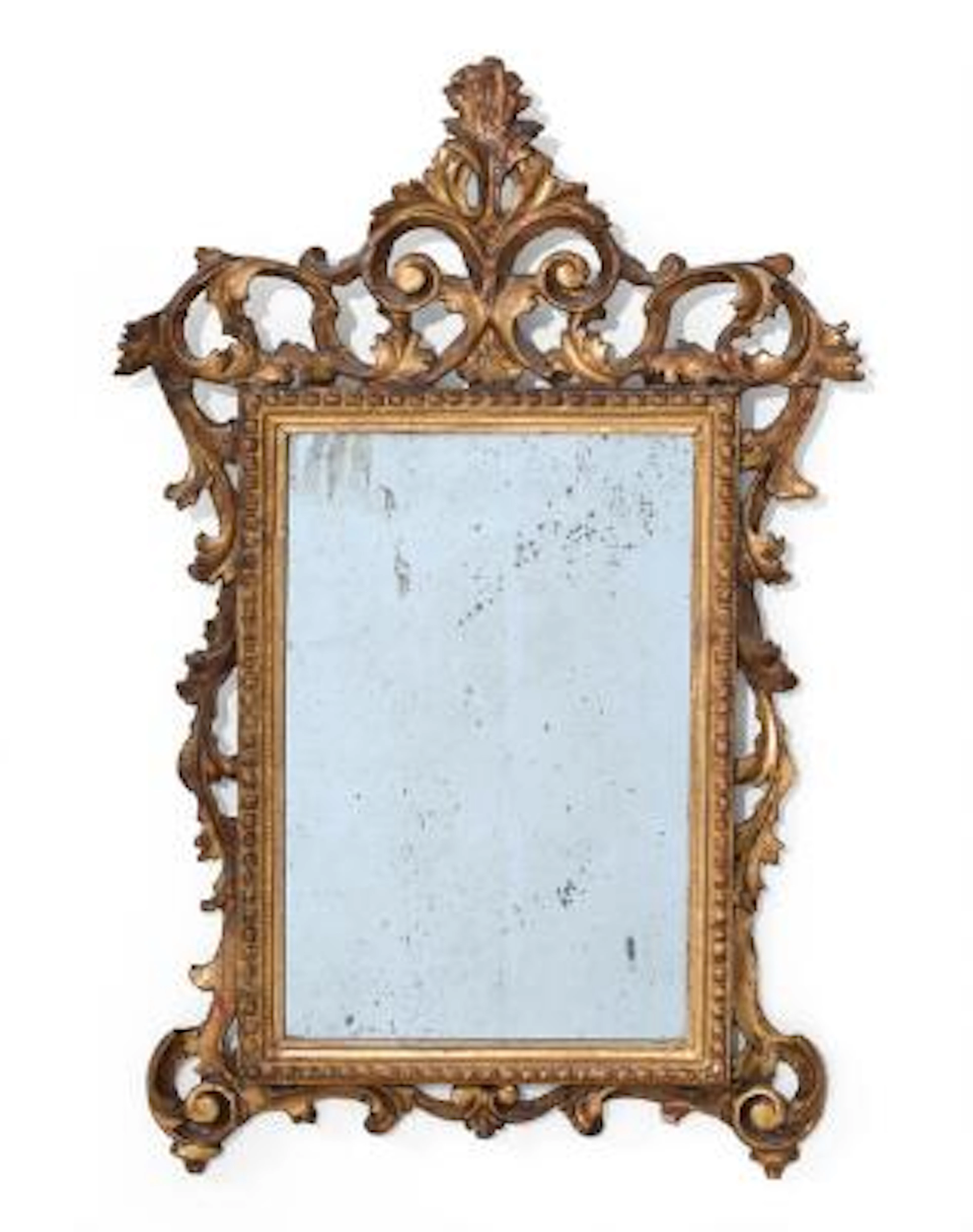 Régence mirror in frame of gilded wood, carved with openwork ornamentation.