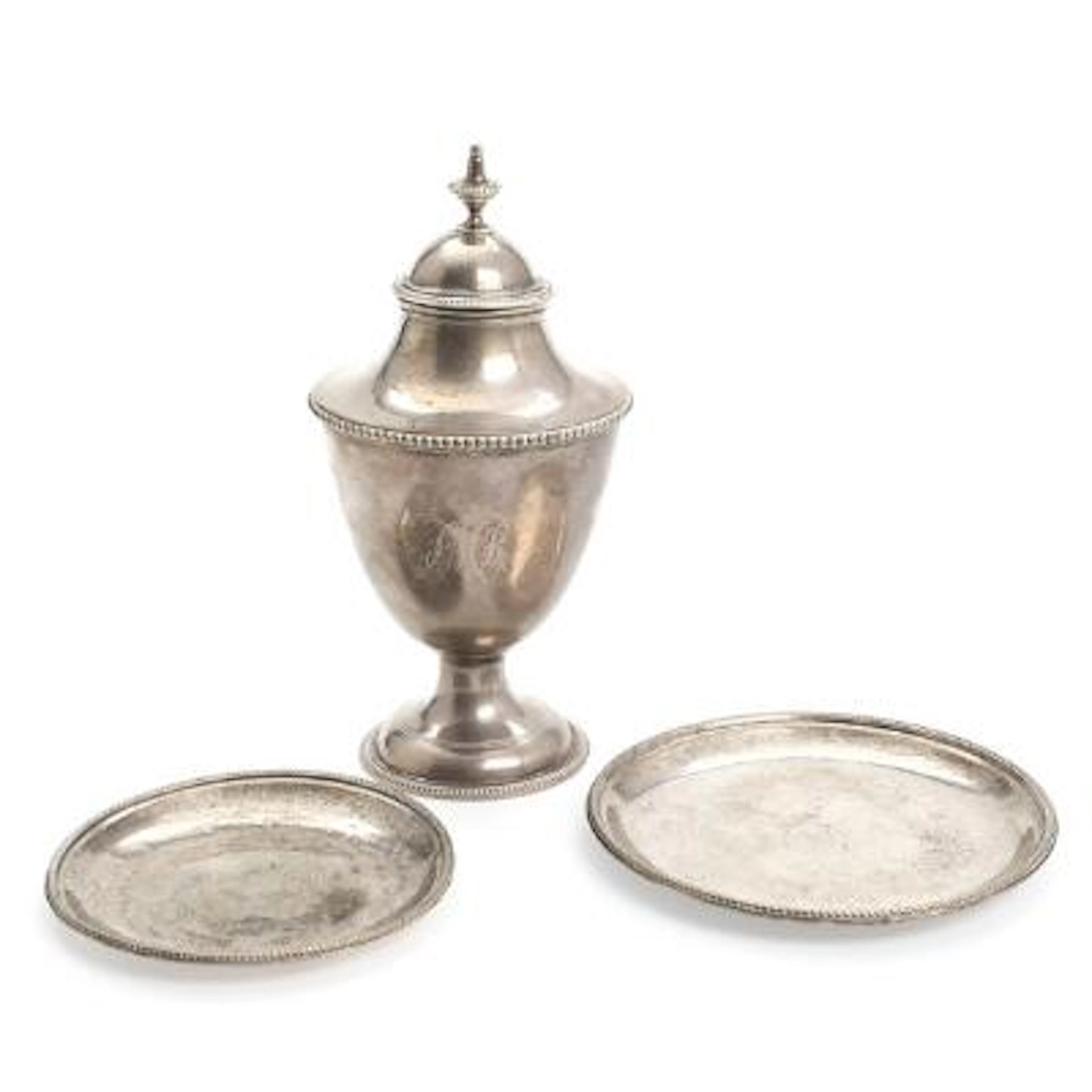 Two English bottle coasters and a teacaddy of sterling silver. London