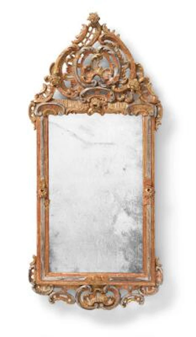 A South German Rococo giltwood and silvered mirror, the top and bottom