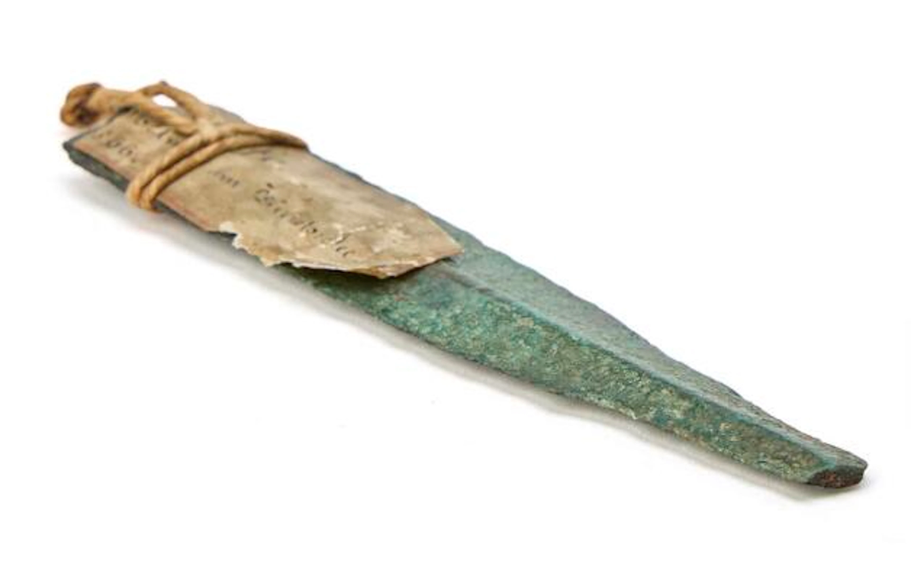 Bronze dagger fragment, approx. 0.6 x 2.7 x 11.9 cm, found in Germany.