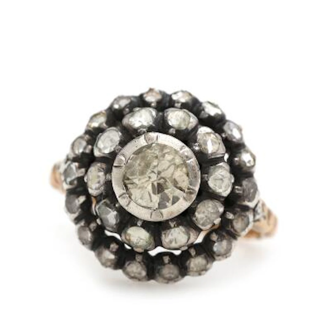 A Belle Epoque diamond ring set with numerous rose-cut diamonds, mounted