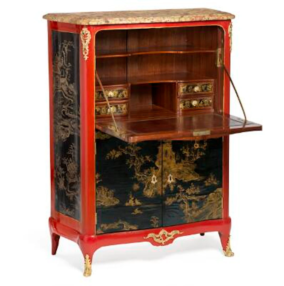 A Louis XV gilt bronze mounted Chinese lacquer and red-japanned secretaire.