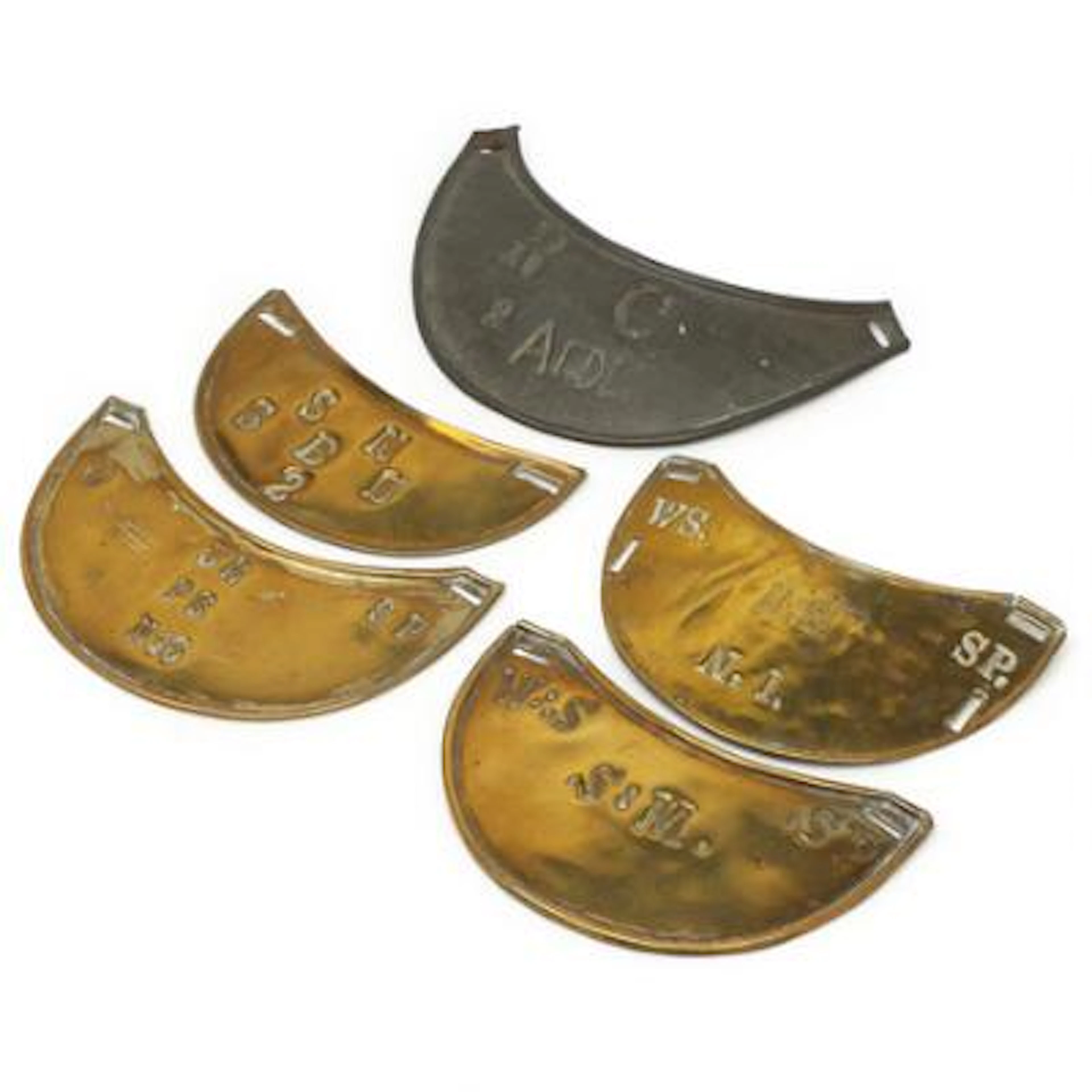 Various ring collars in brass and zinc with different letters and