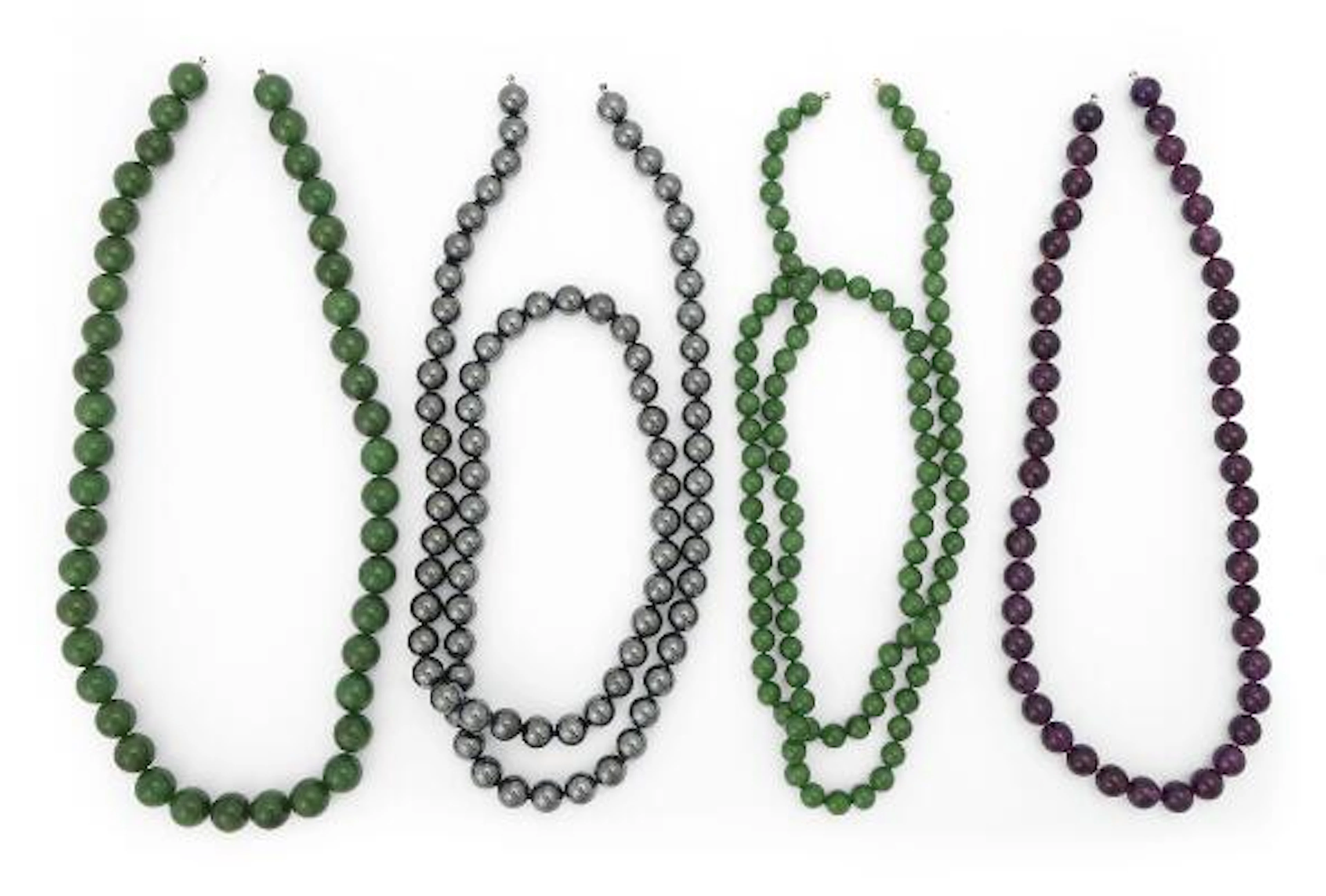 A collection of necklaces comprising polished beads of ametysts, aventurine