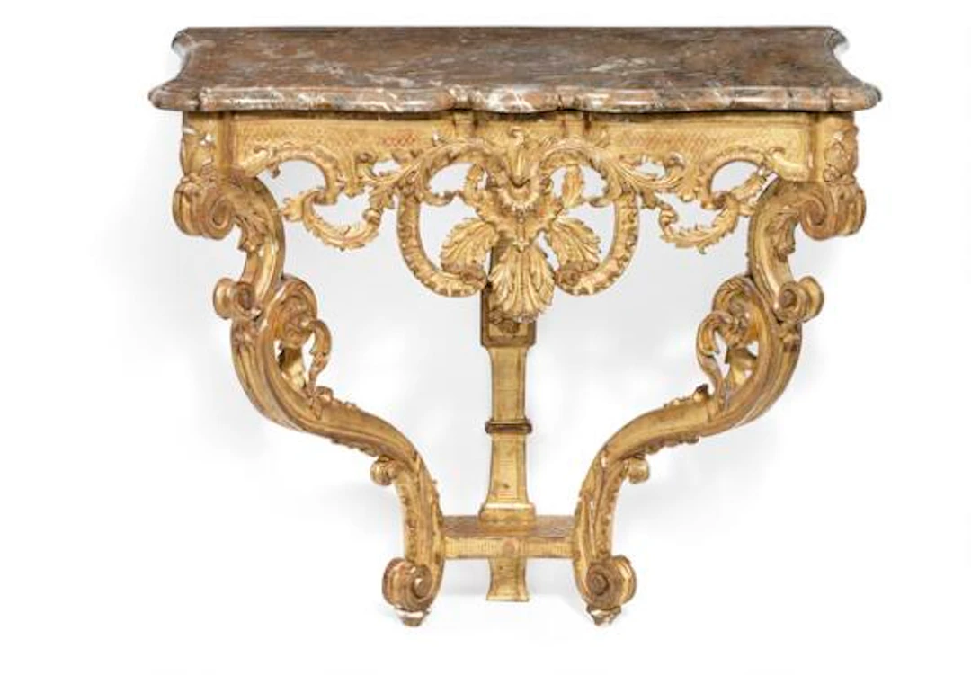 A Régence giltwood console table in the manner of Jules Degoullon.