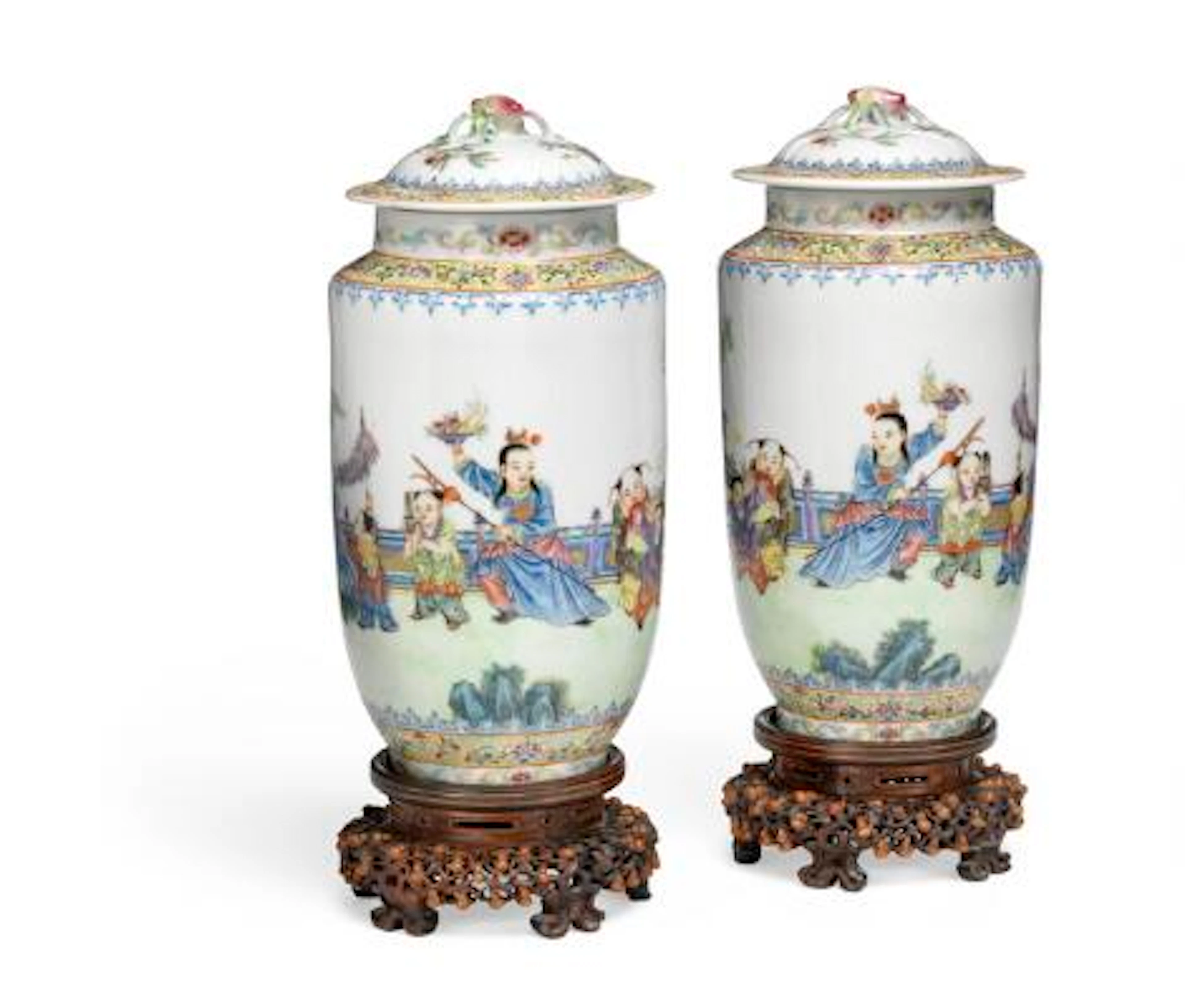 A pair of Chinese porcelain vases with cover. Marked Qianlong, but