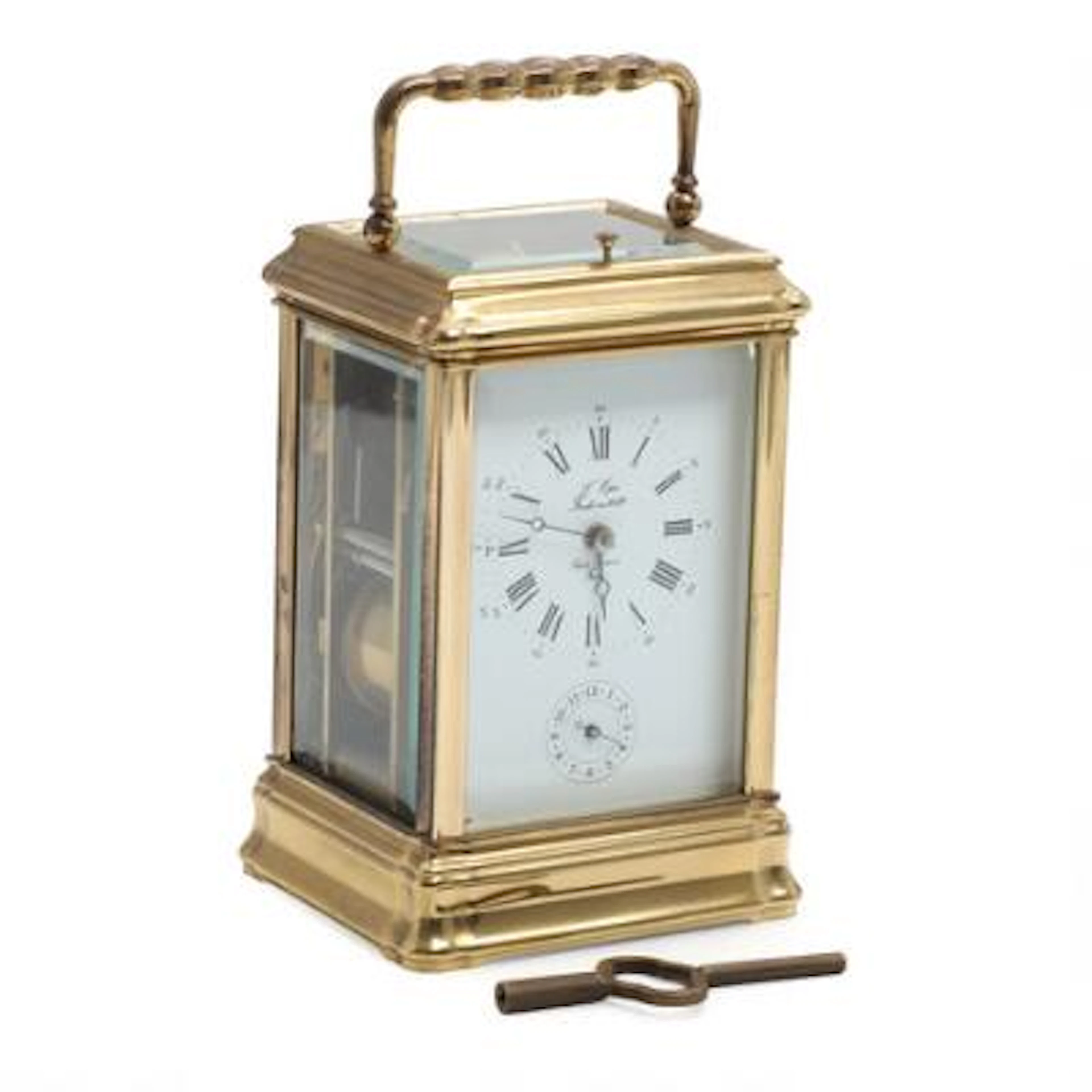A French 20th century brass and cut-glass travel clock. H. 14.5 cm.
