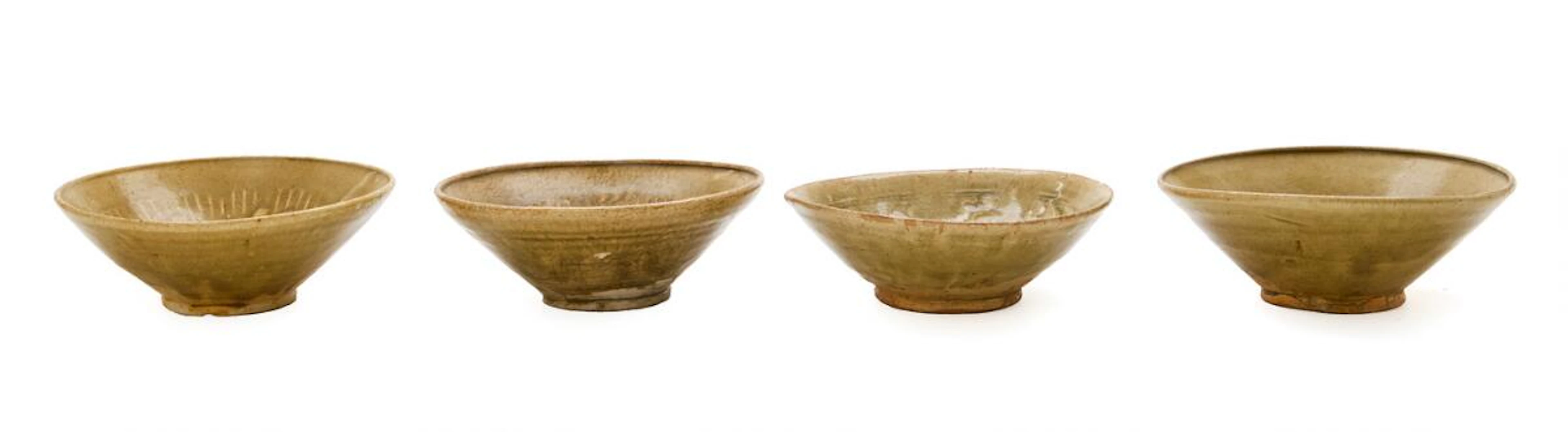 Four Vietnamese green-glazed pottery bowls. Ly/Tran dynasty 1009-1400.