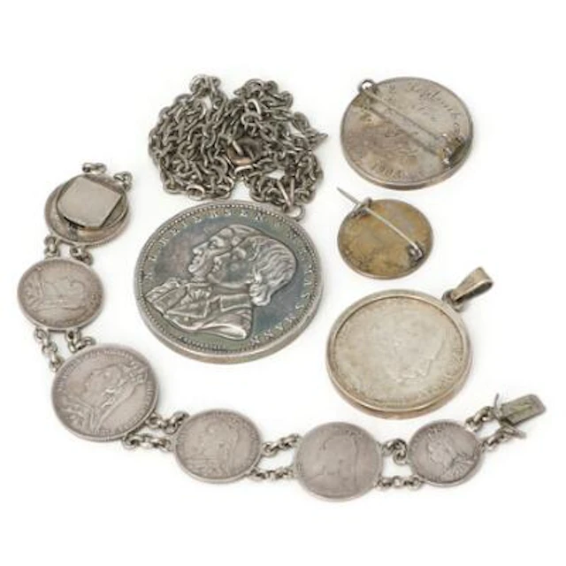 Lot cont various silver coins and medals converted into necklaces