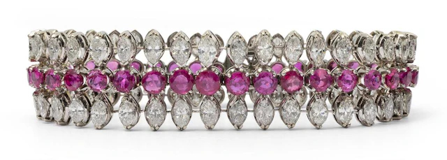 A ruby and diamond bracelet set with numerous rubies and diamonds