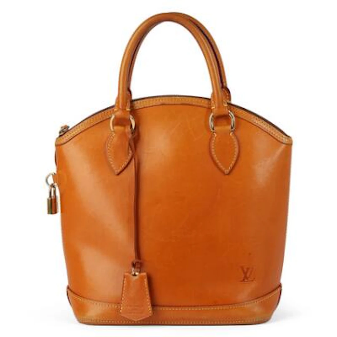 Louis Vuitton: A "Nomade Lockit" bag in brown leather with gold tone