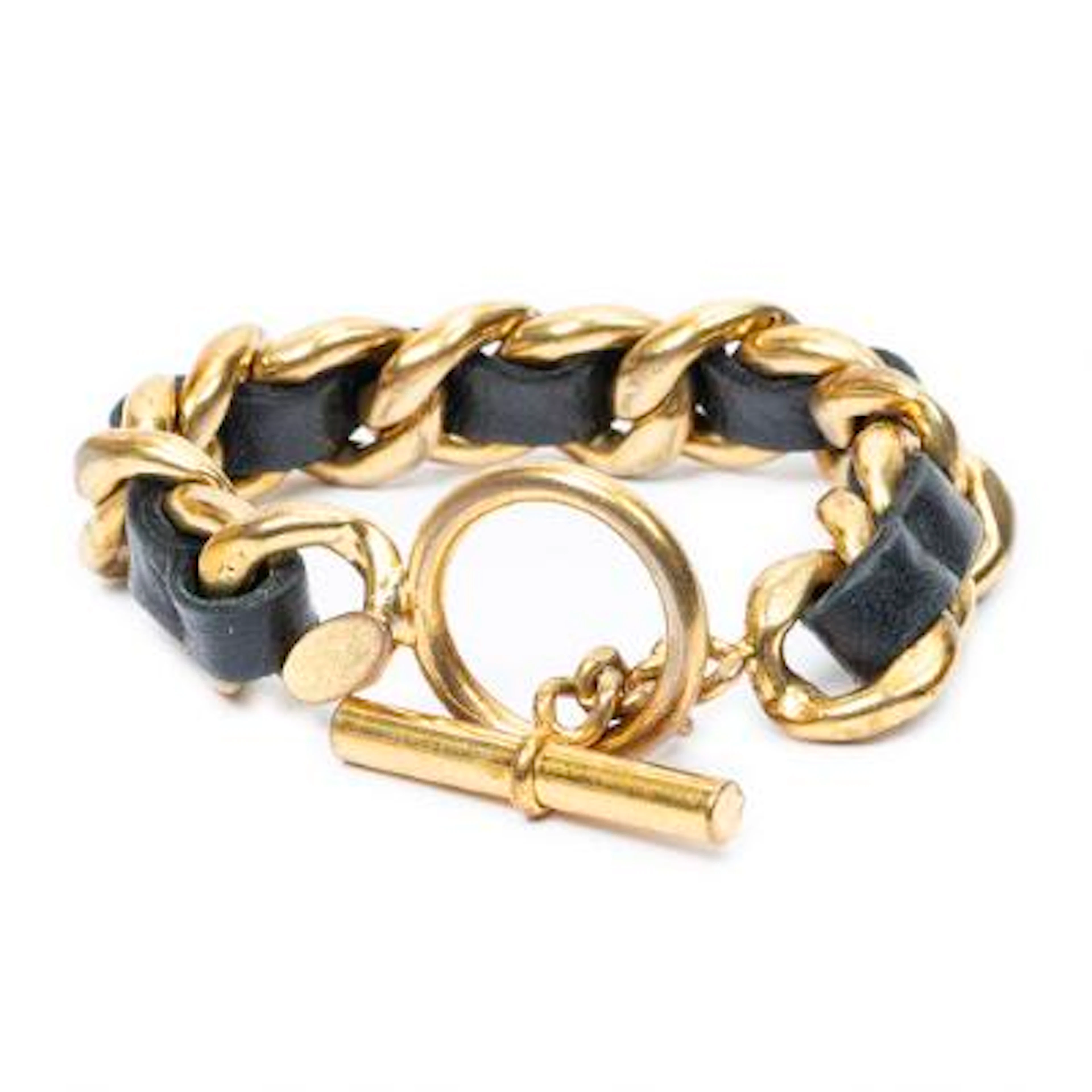Chanel: An interlace chain bracelet in gold-toned metal and black