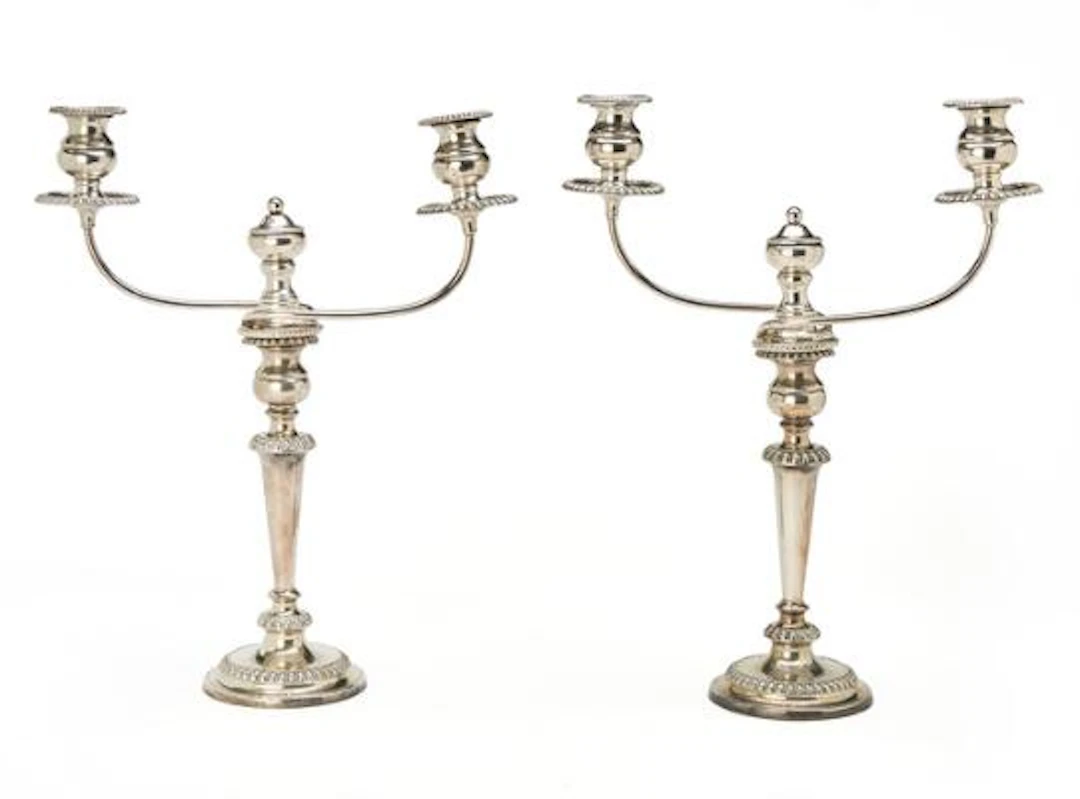 A pair of silverplated twoarmed candelabra. Filled. 20th century.