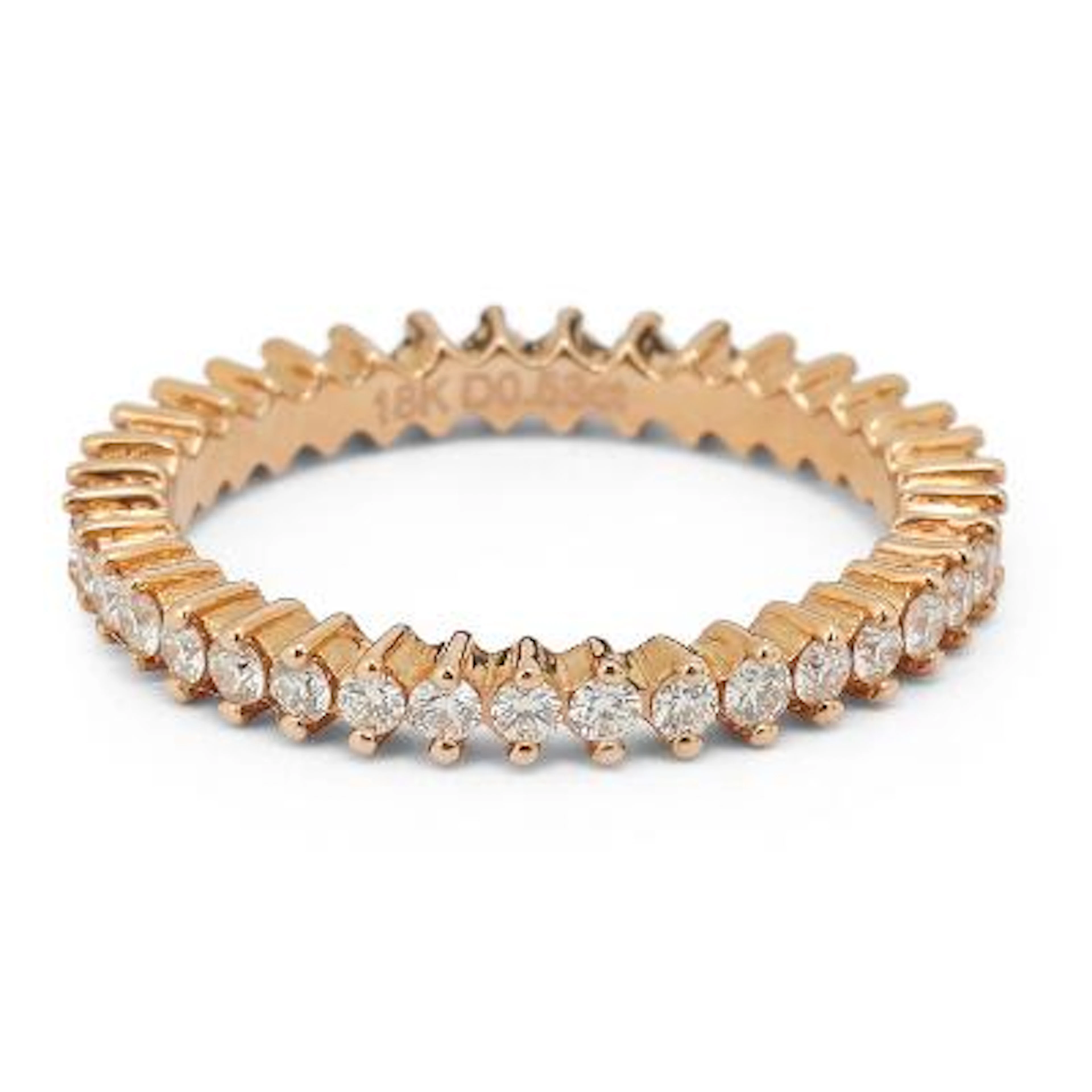 An eternity diamond ring set with numerous diamonds mounted in 18