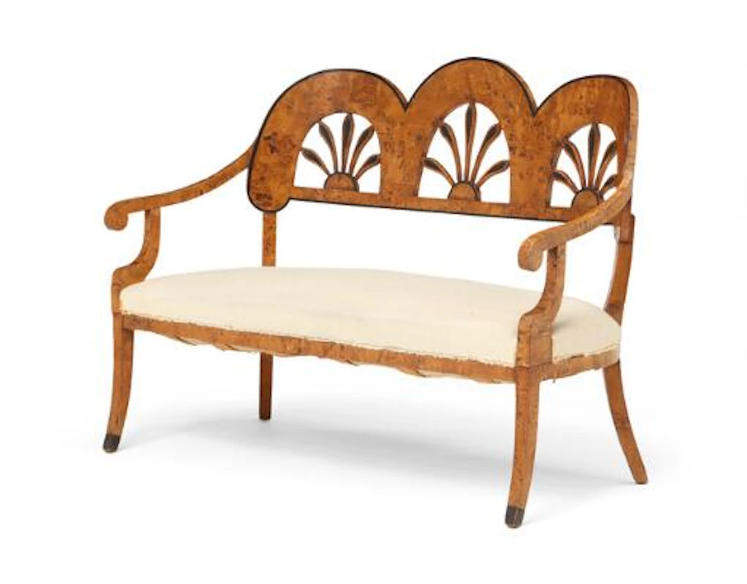 An Austrian Late Empire sofa of stained rootwood and birchwood, curved