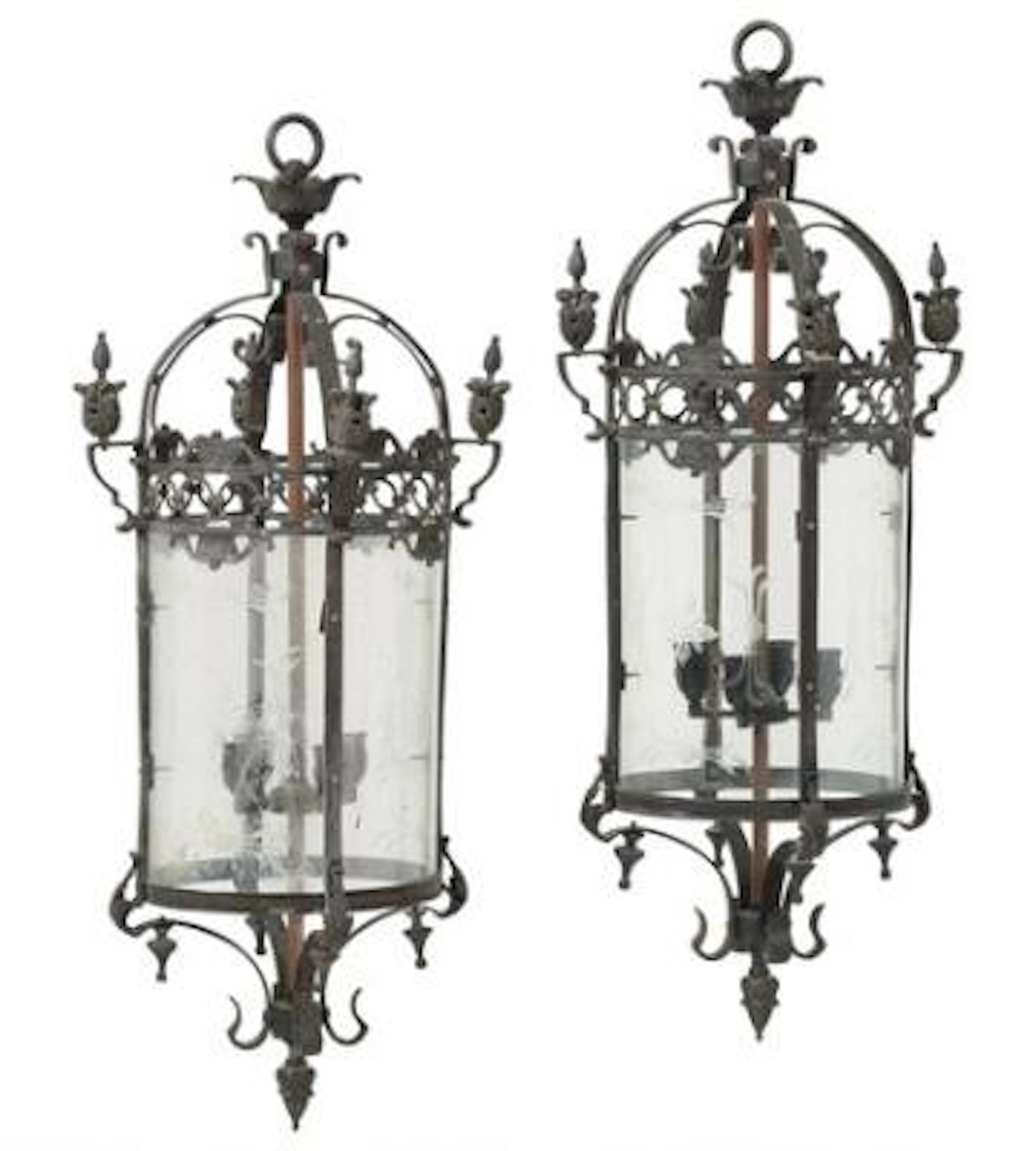 A pair of French wall lights in painted iron, curved sides with cut