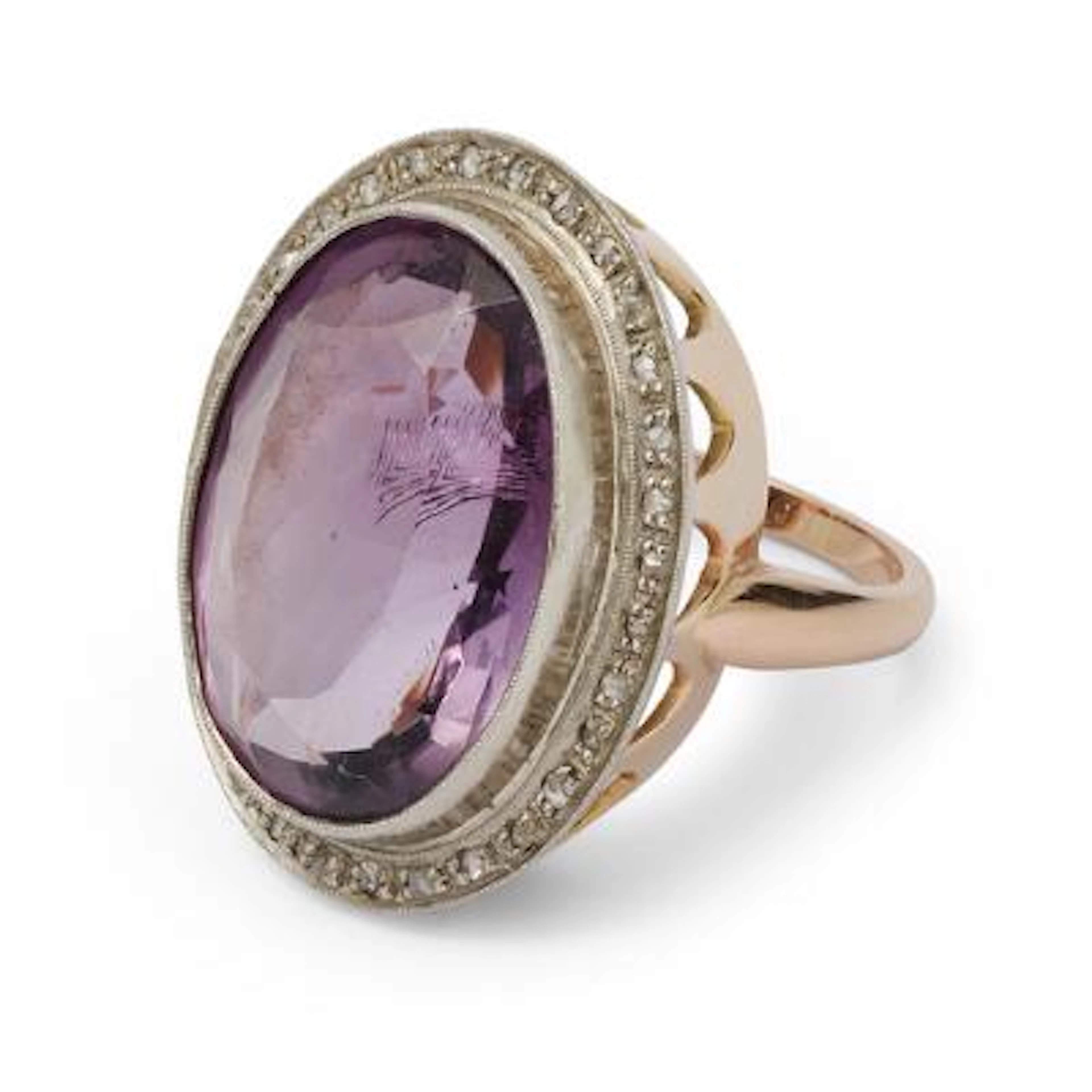 An amethyst ring set with an oval-cut amethyst and dimonds, mounted