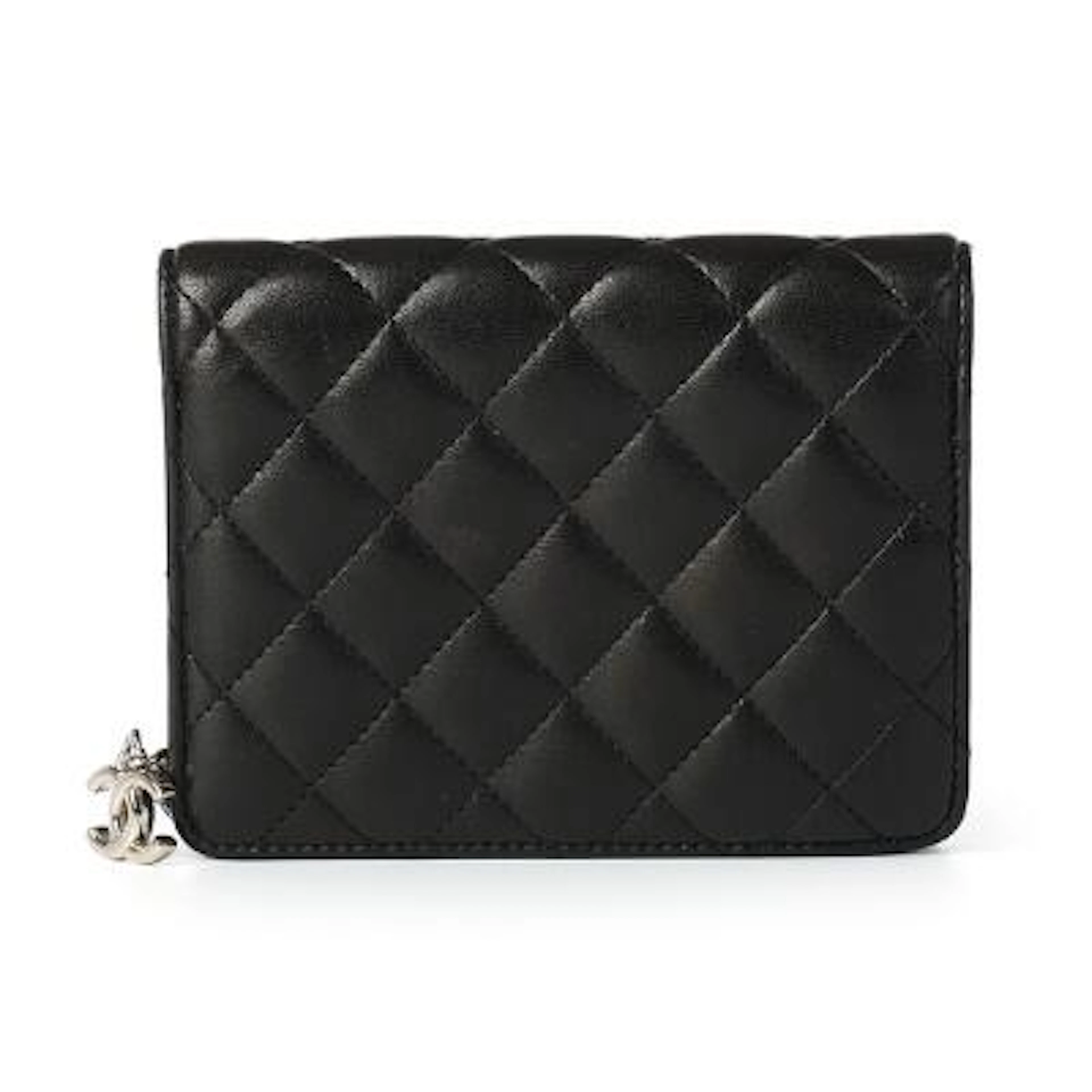 Chanel: A wallet of black quilted leather with silver-toned hardware
