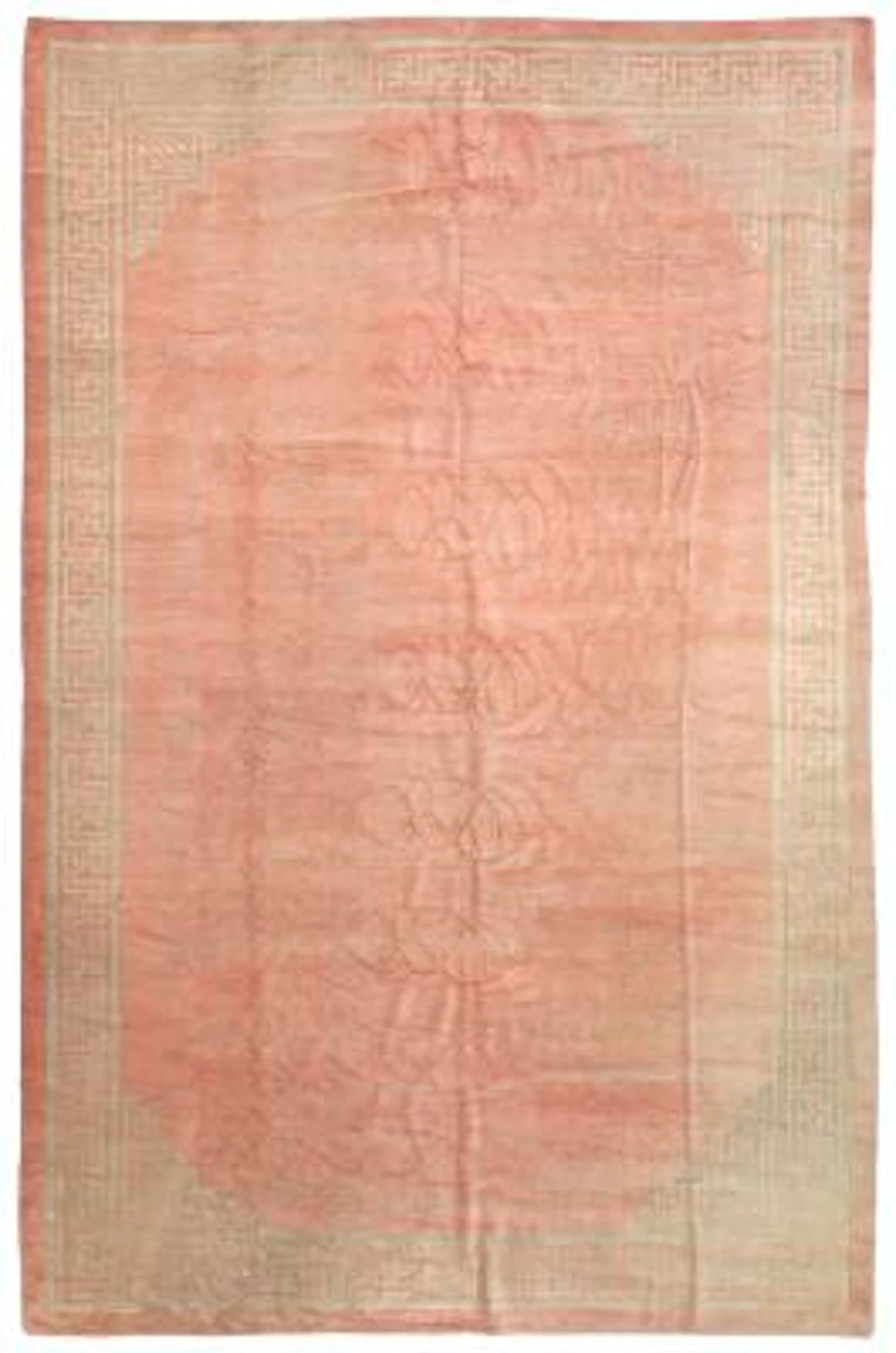 A Chinese carpet, open soft pink colored field surrounded by meander