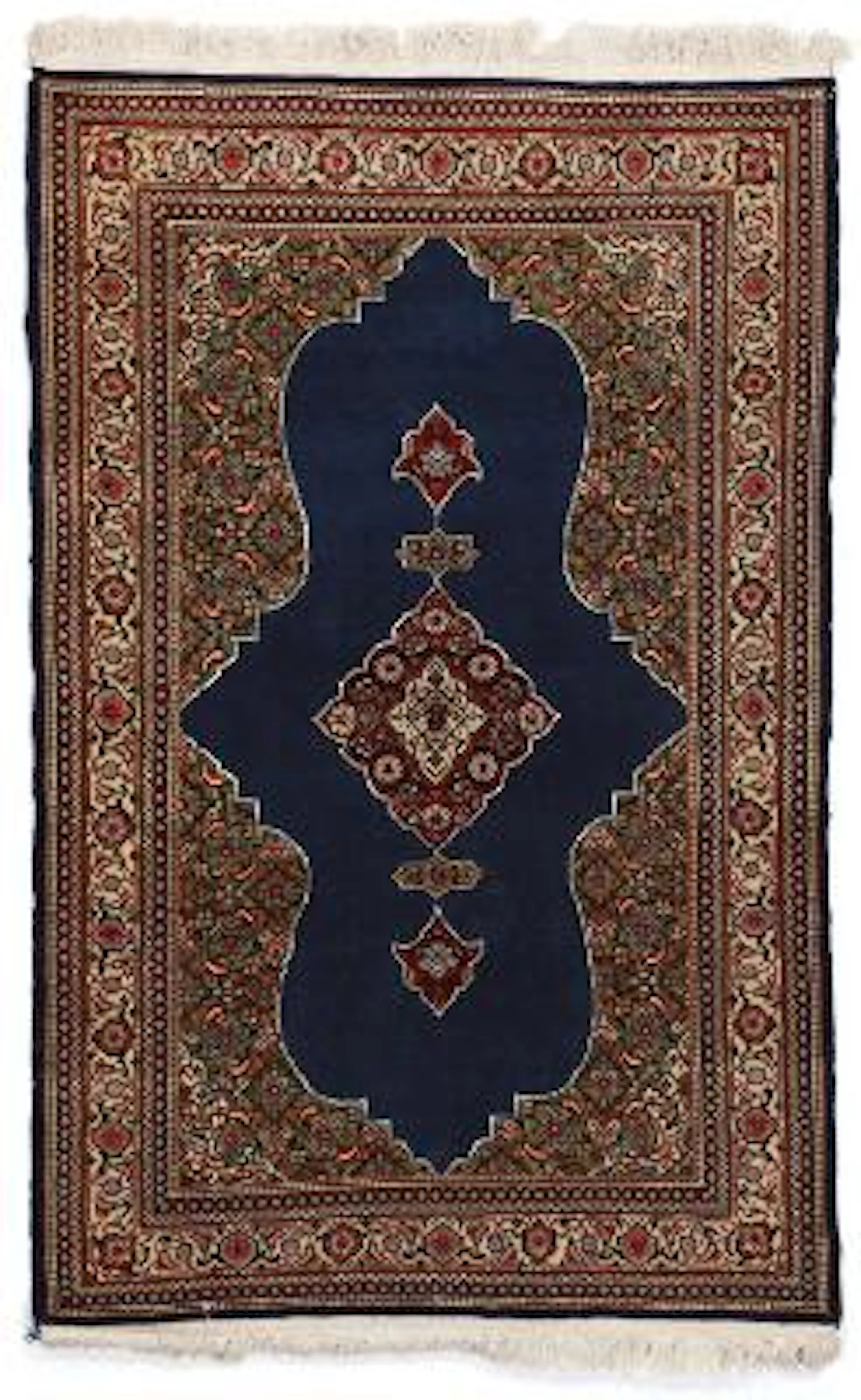 A Sarouk rug, Persia. Medallion design on a shield shaped field. Late