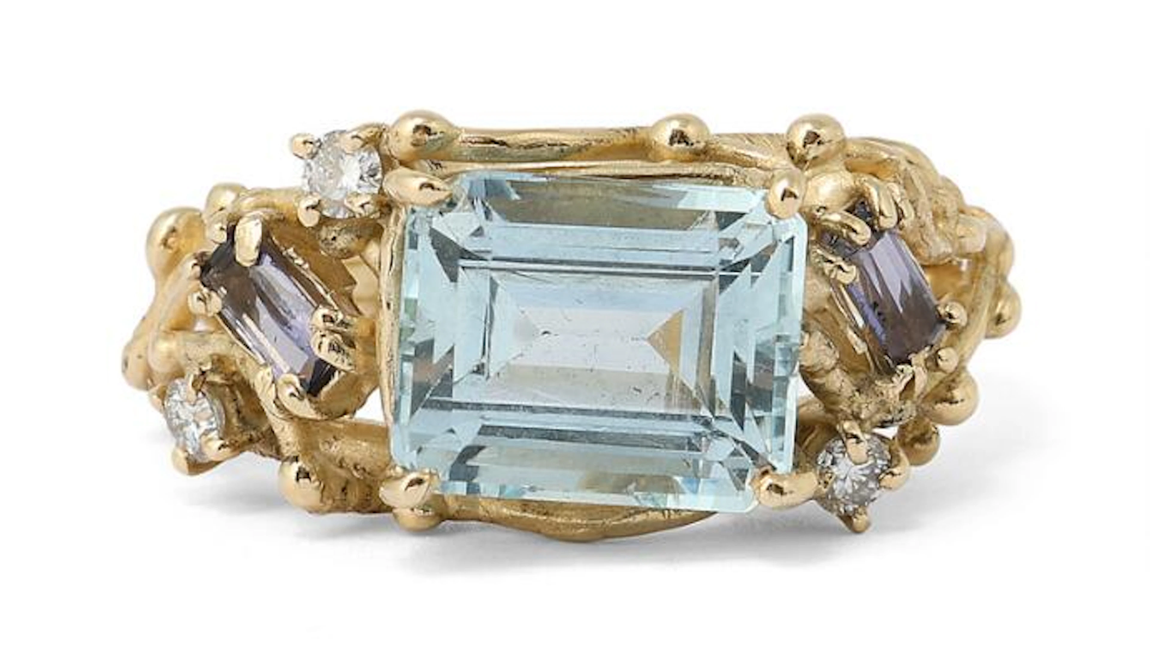 An aquamarine, iolite and diamond ring set with aquamarine, iolites