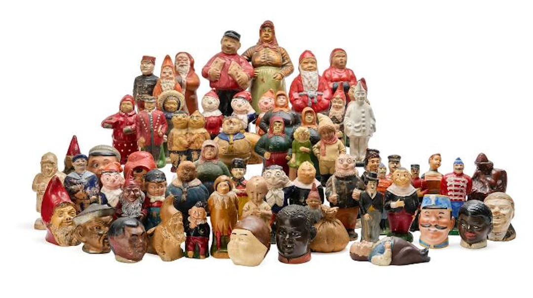 A collection of money boxes in the form of various figures, gnomes