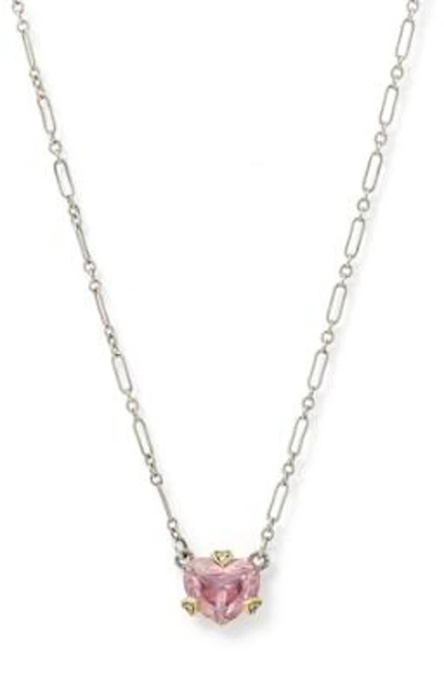 A heartshaped pendant set with a cubic zirconia and diamonds, mounted