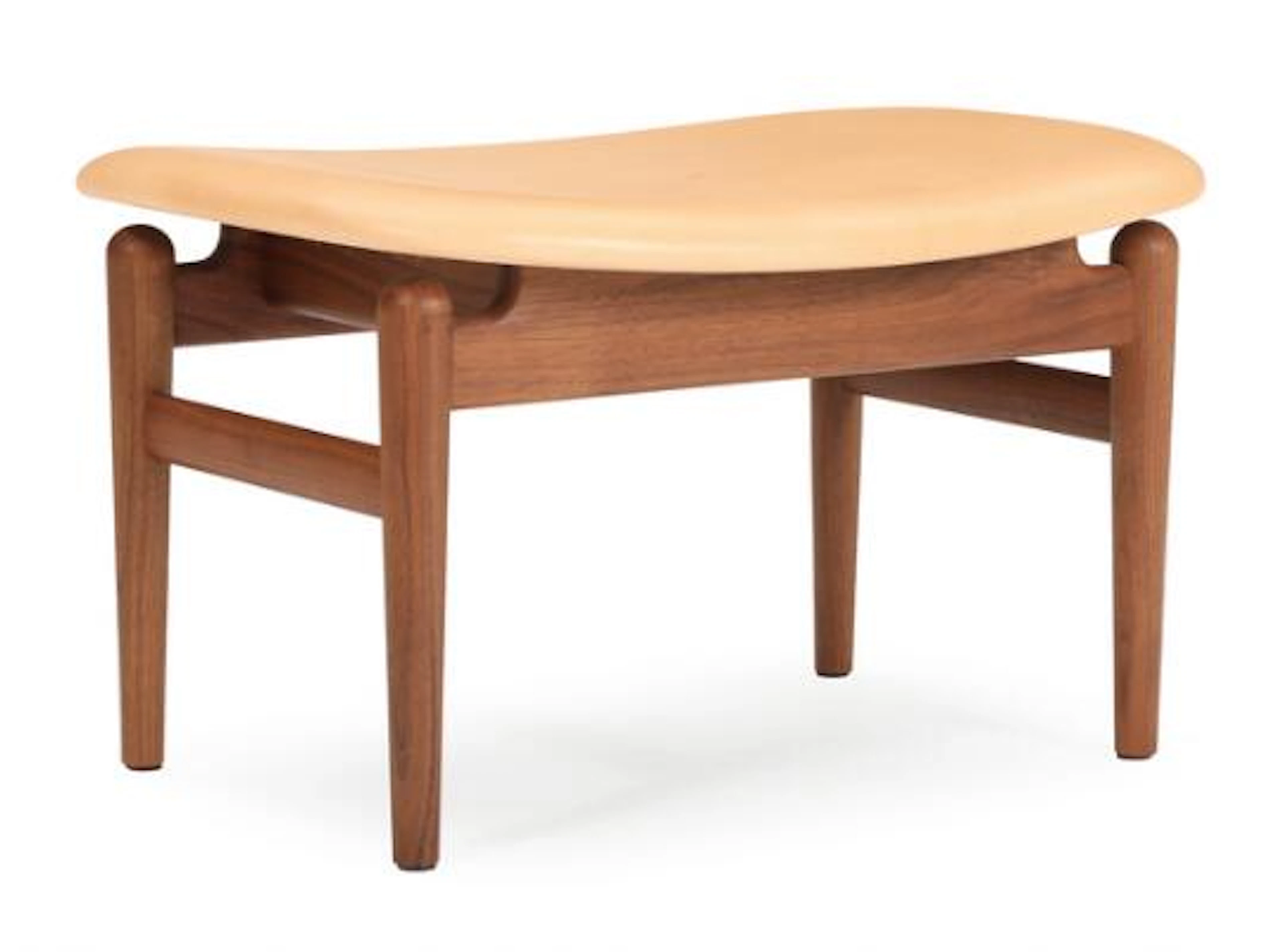 Finn Juhl: “The Chieftain stool”. A wallnut stool. Upholstered in