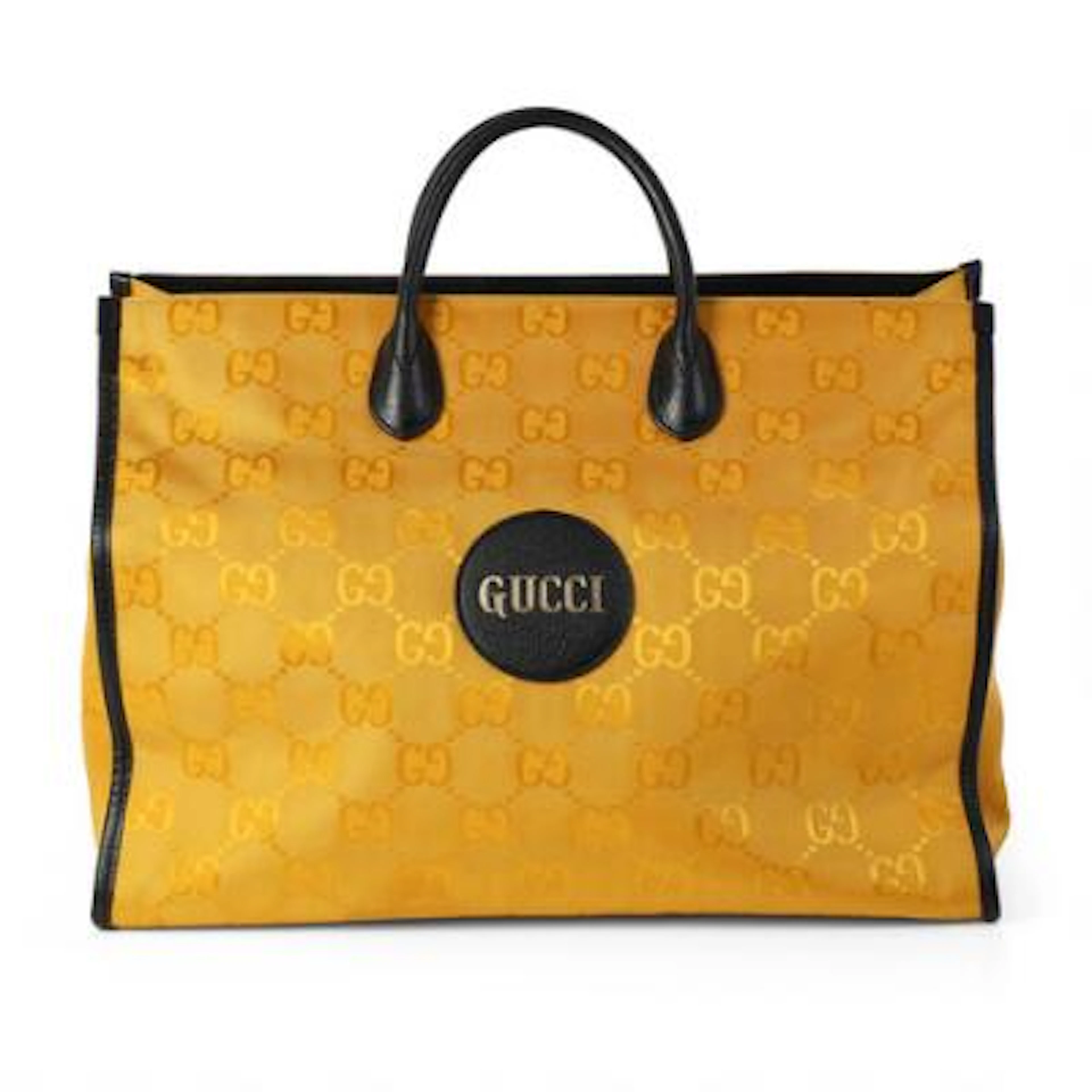 Gucci: An "Off The Grid" tote bag of yellow monogram canvas with black