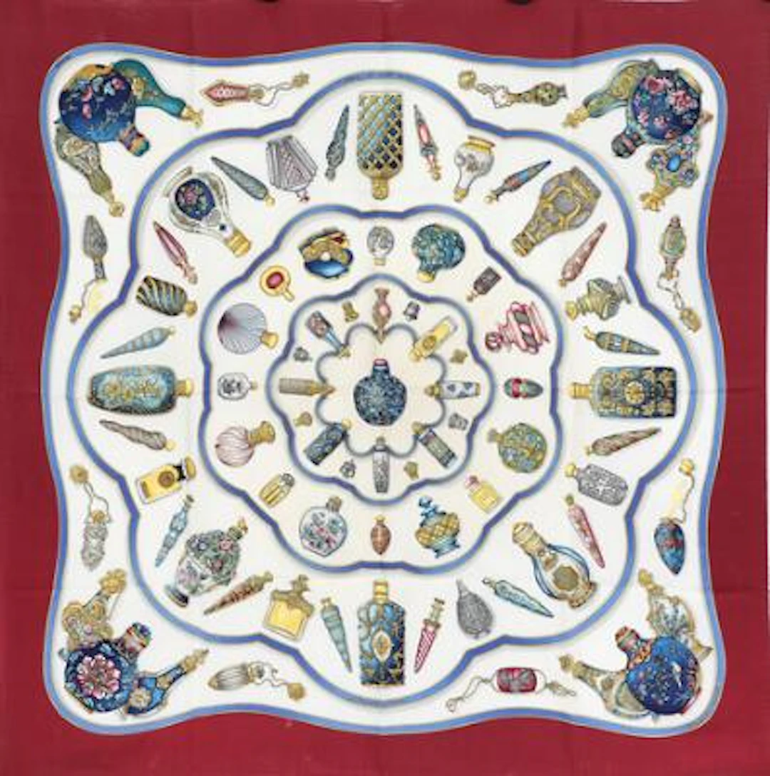 Hermès: A silk scarf with motif “Qu Importe Le Flacon” by Caty Latham.