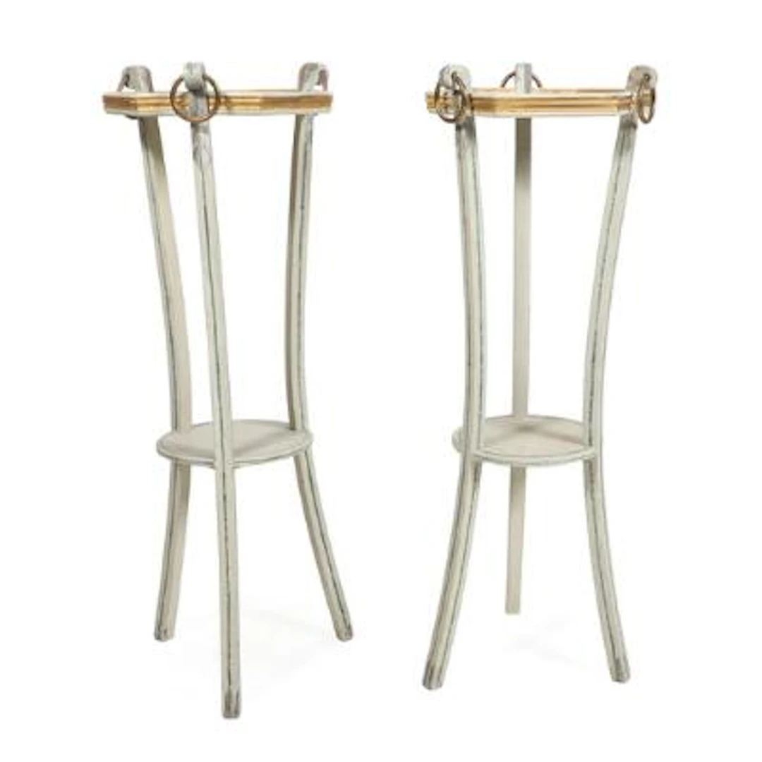 A pair of pedestals in white painted wood with staffwork in green