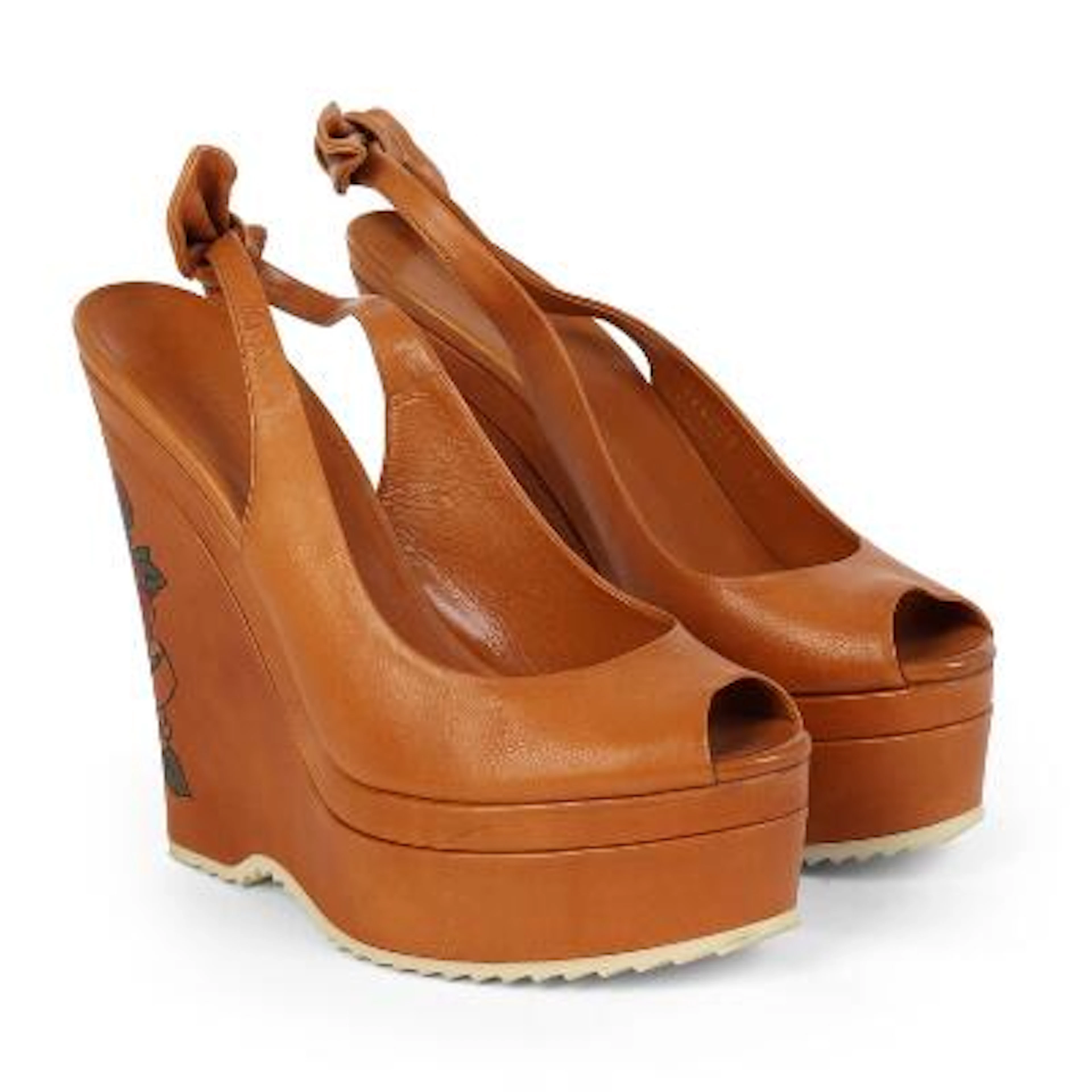 Gucci: A pair of "Tattoo Heart" wedge-heel sandals crafted from brown