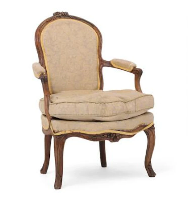 Rococo armchair of beech, carved with cabriole legs and foliage. Mid-18th