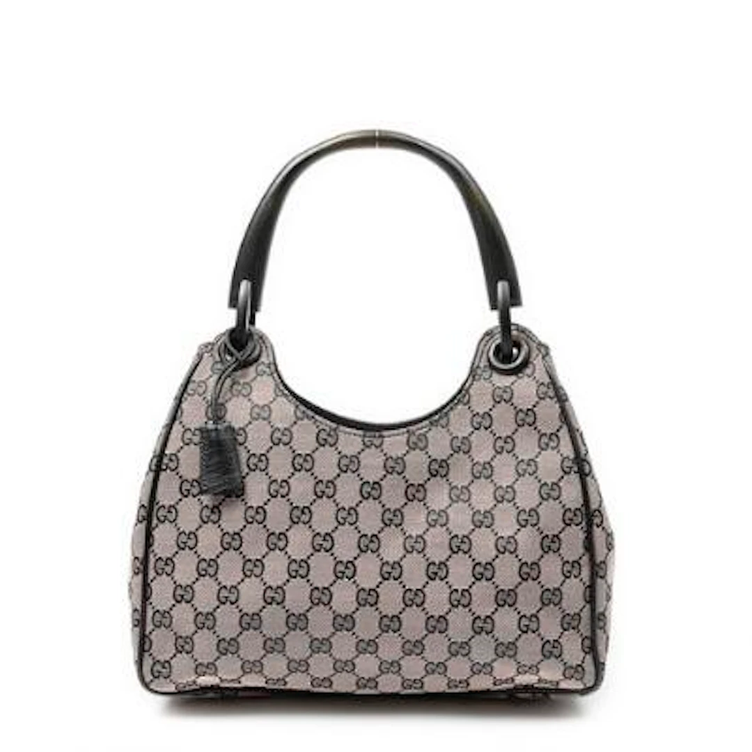Gucci: A "Small Wooden Handle Colbert Hobo" bag of pink/black monogram