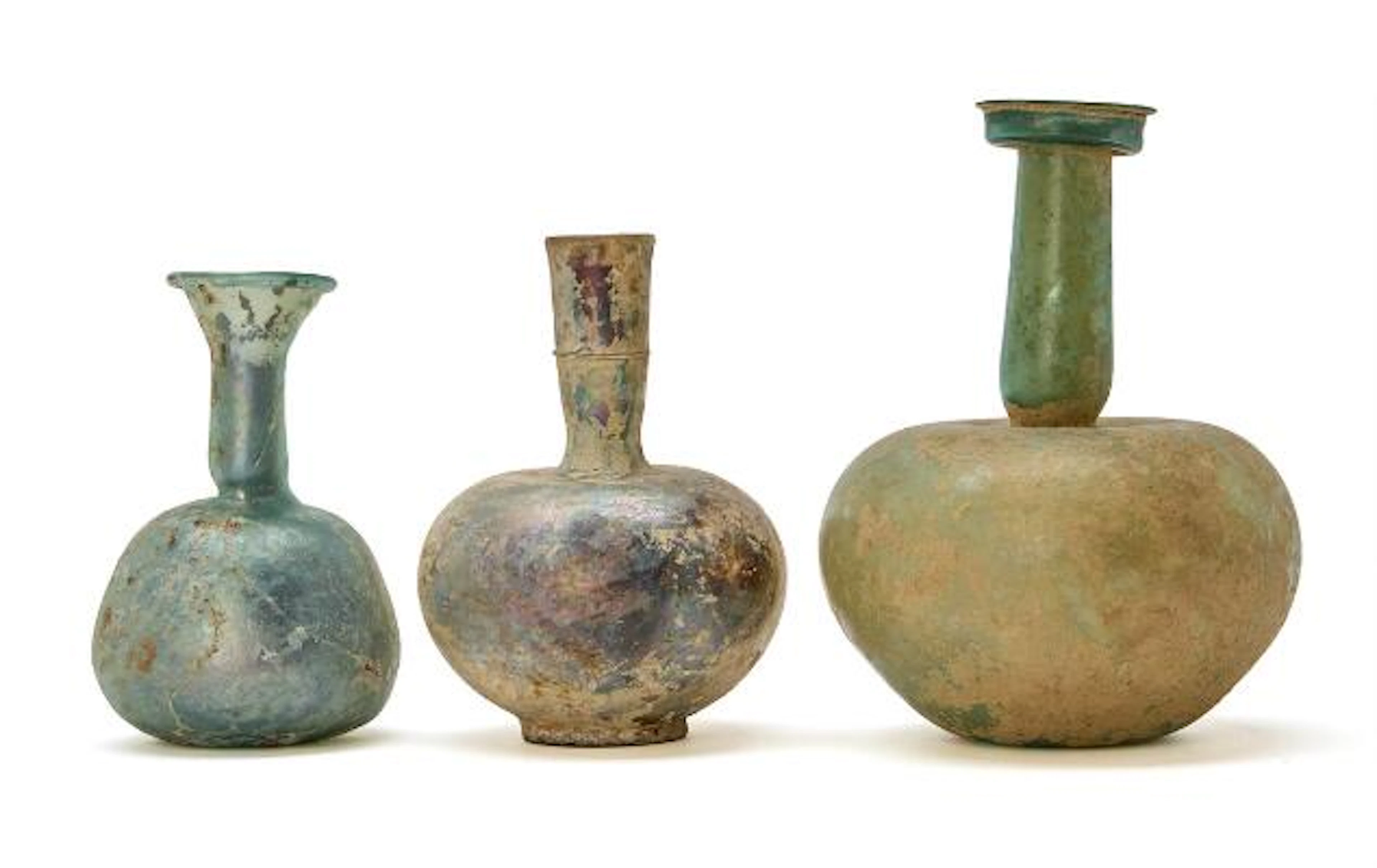 Two Roman and one Late Roman/Byzantine glass bottle. 3rd-5th century