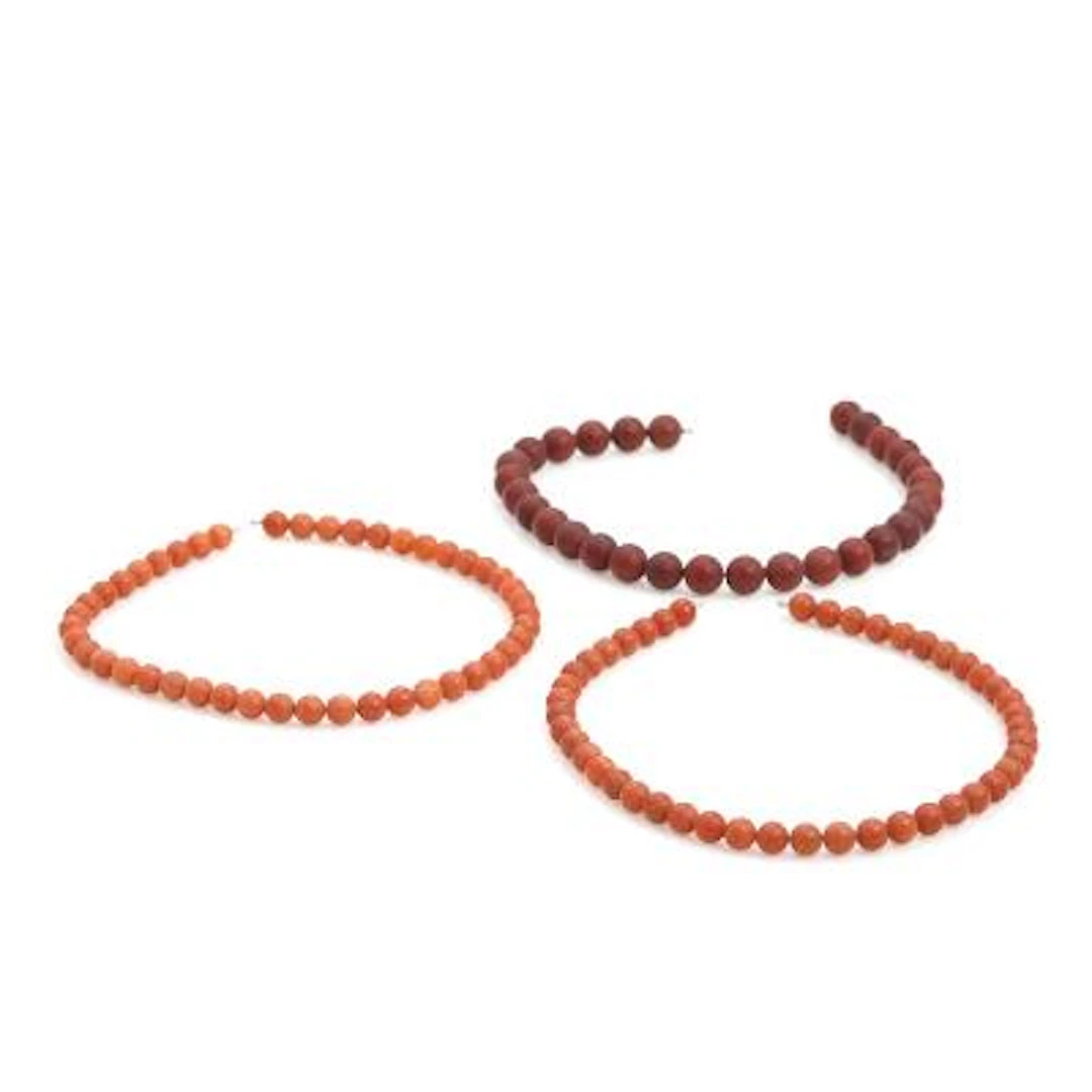 Three necklaces with beads of red gemstones mounted with Lynggaard