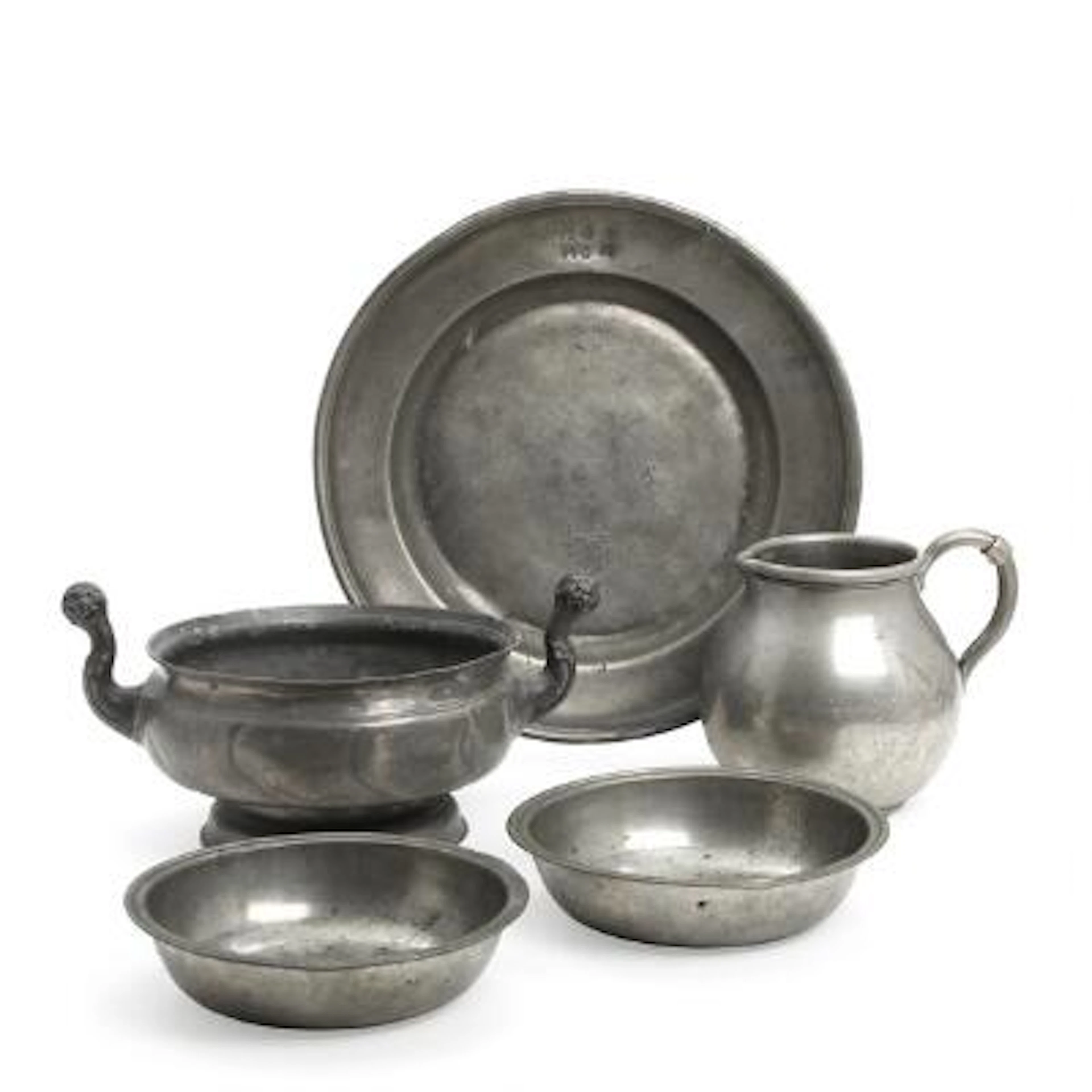 A collection of pewter, consisting of a jug, two bowls, a round dish