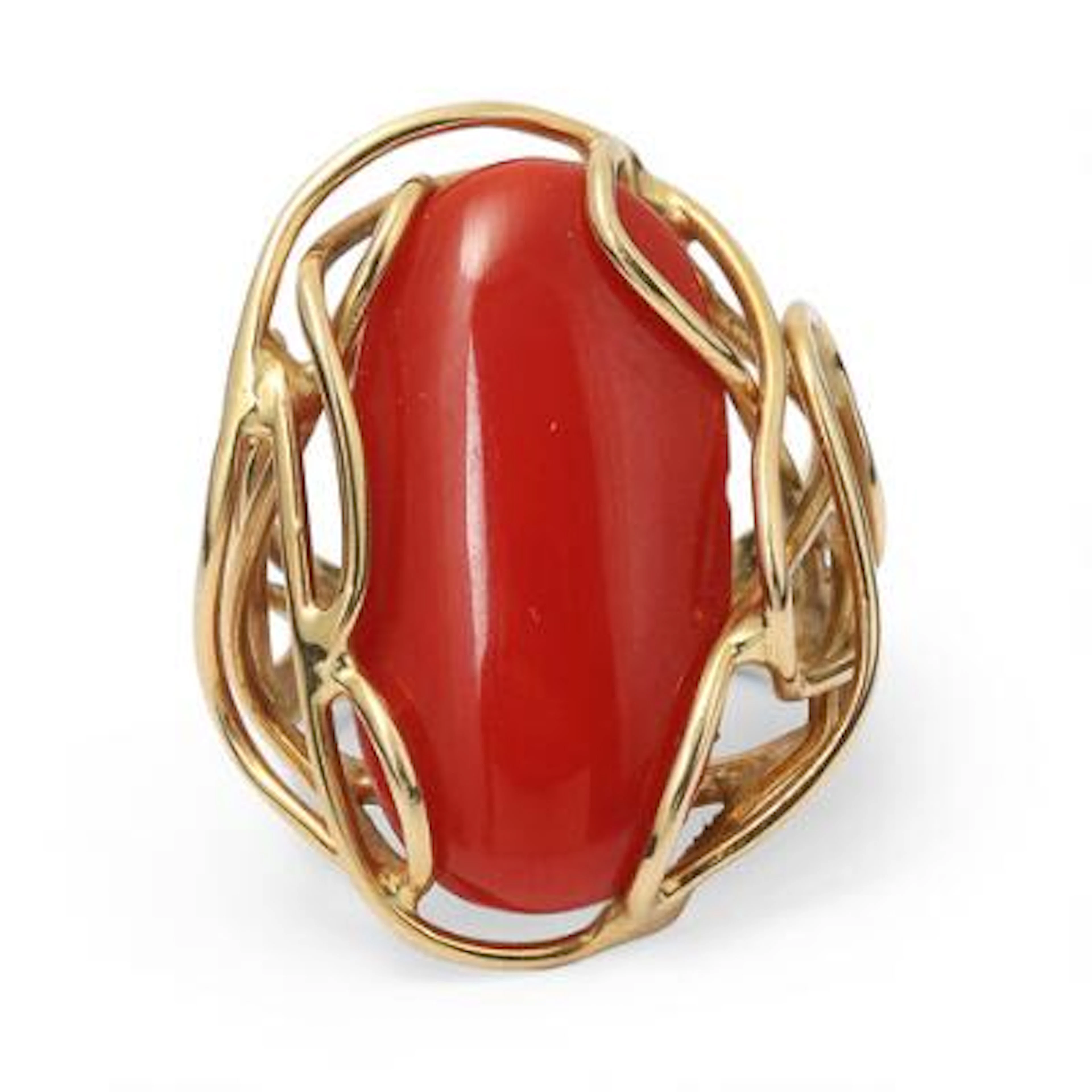 A coral ring set with an oval-cut coral, mounted in 18k gold. Weight