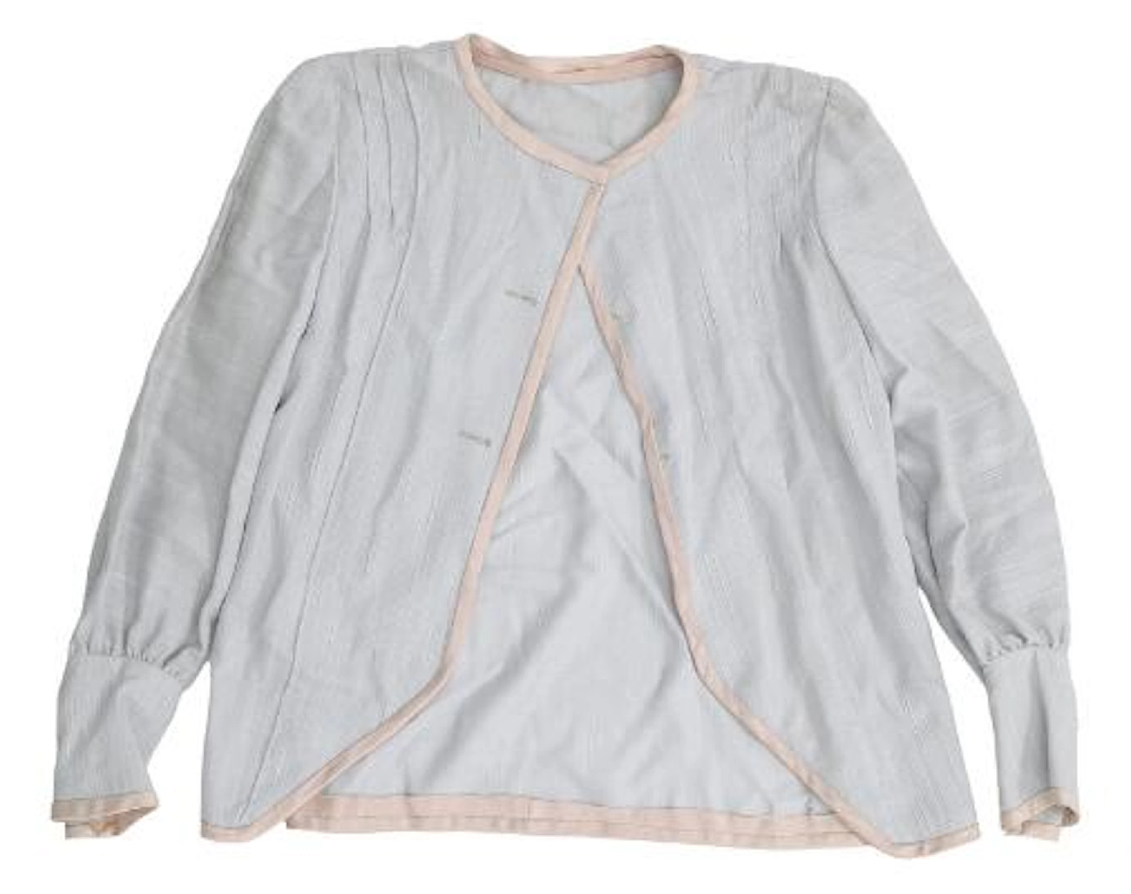Blouse of beige coloured syntetic material. Worn by Maude Varnæs (Malene