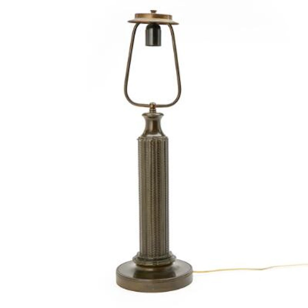 Just Andersen: A large patinated “disko” metal table lamp. Stem cast