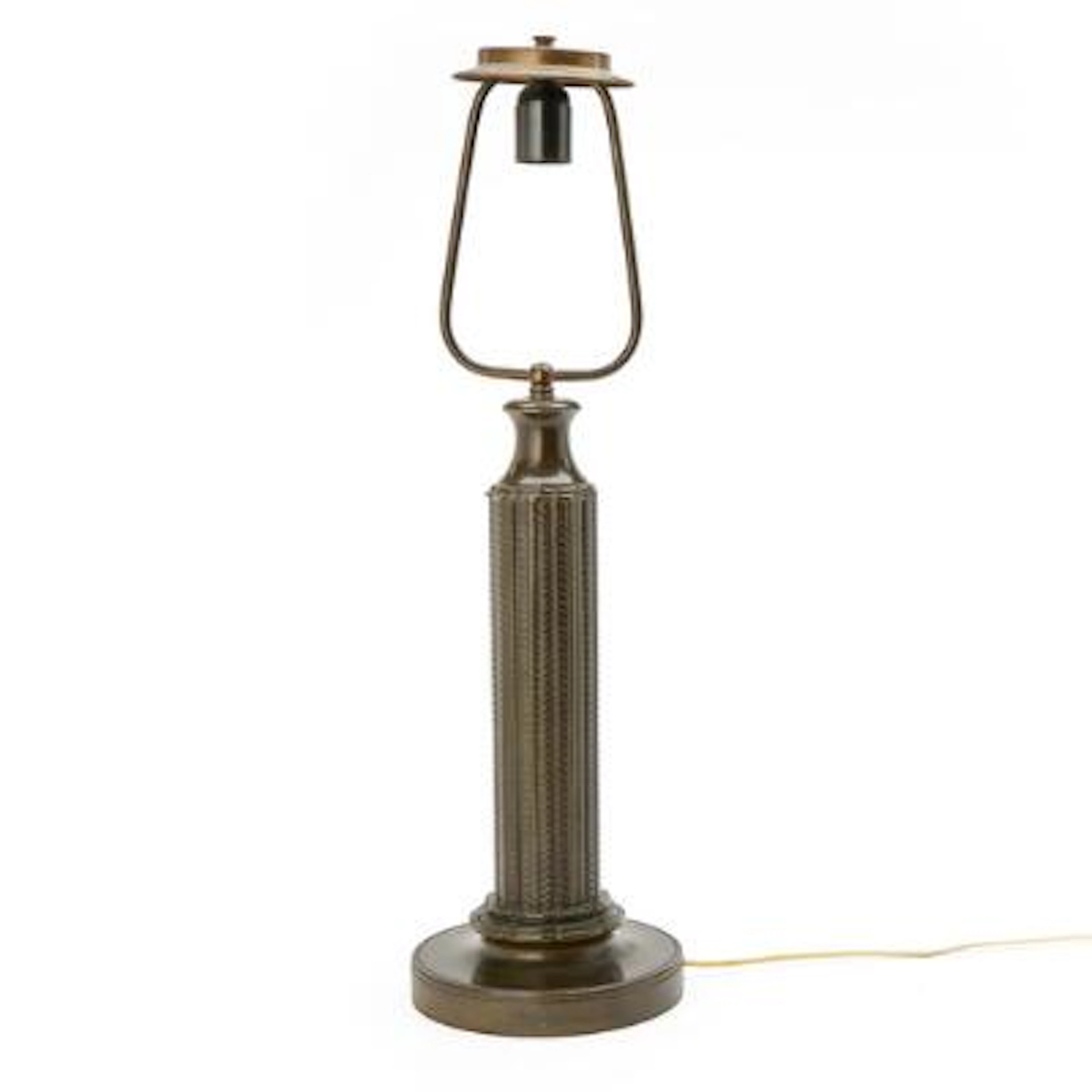 Just Andersen: A large patinated “disko” metal table lamp. Stem cast