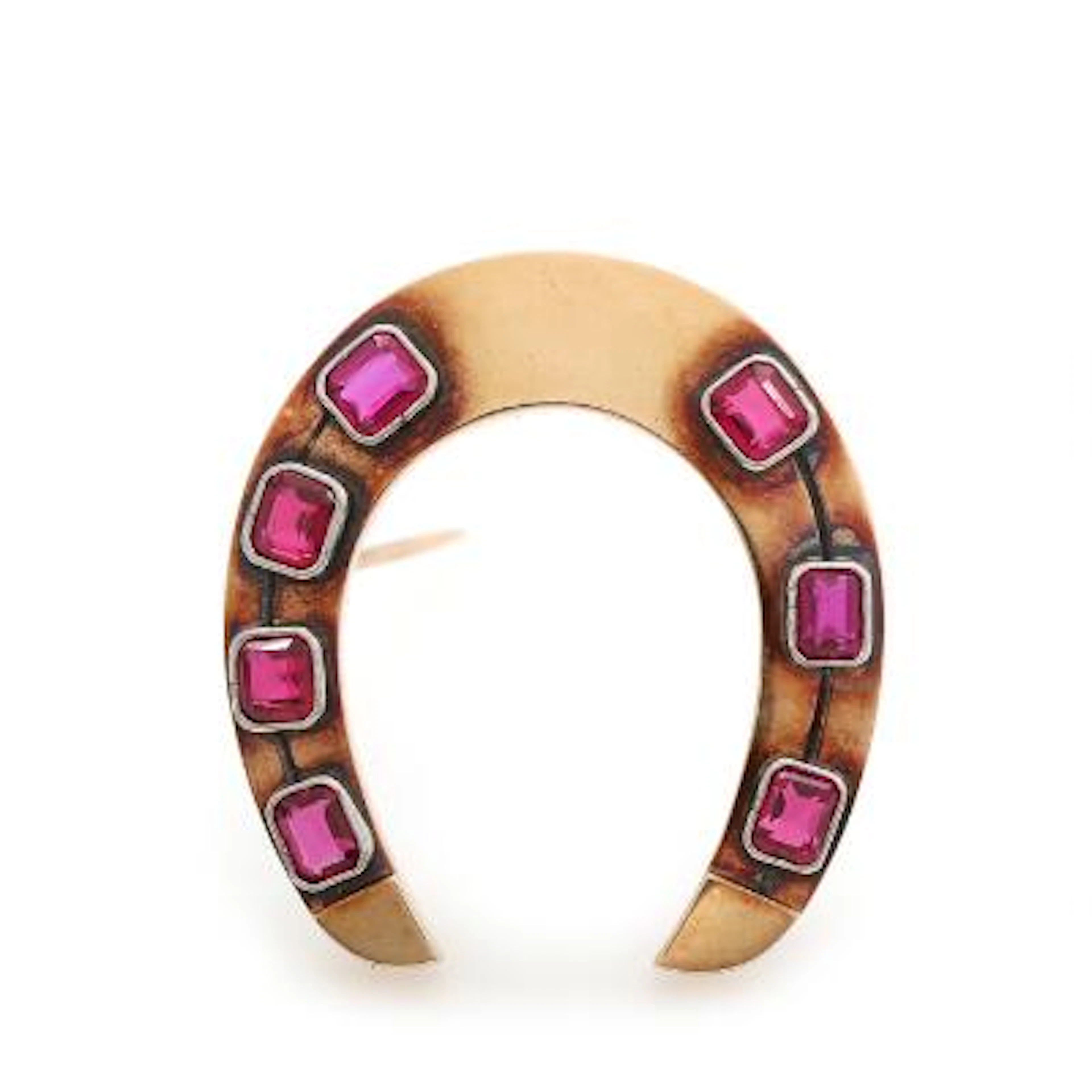 A ruby brooch set with syntetic rubies, mounted in 14k gold and white